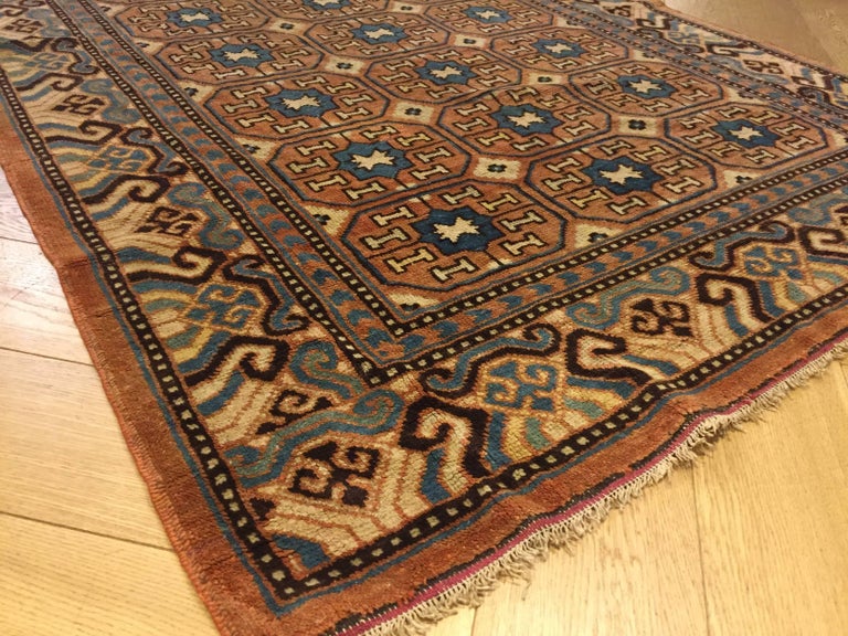 19th Century Brown and Blue Stylized Rosette Gul Chinese Khotan Rug ...
