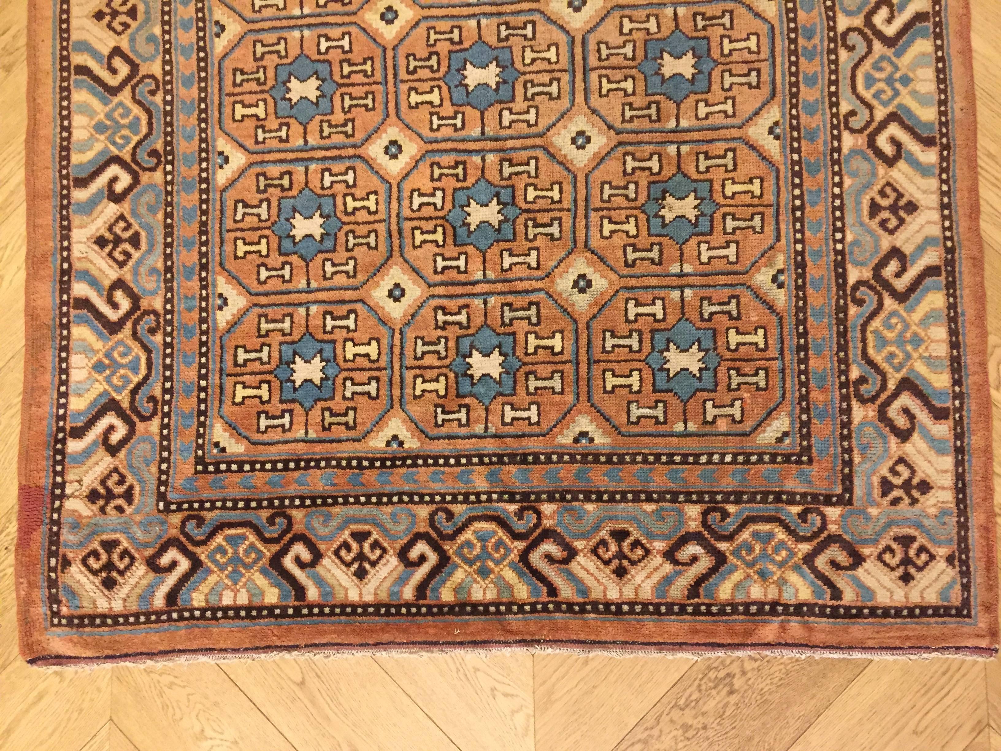 19th Century Brown and Blue Stylized Rosette Gul Chinese Khotan Rug, circa 1870s For Sale 1