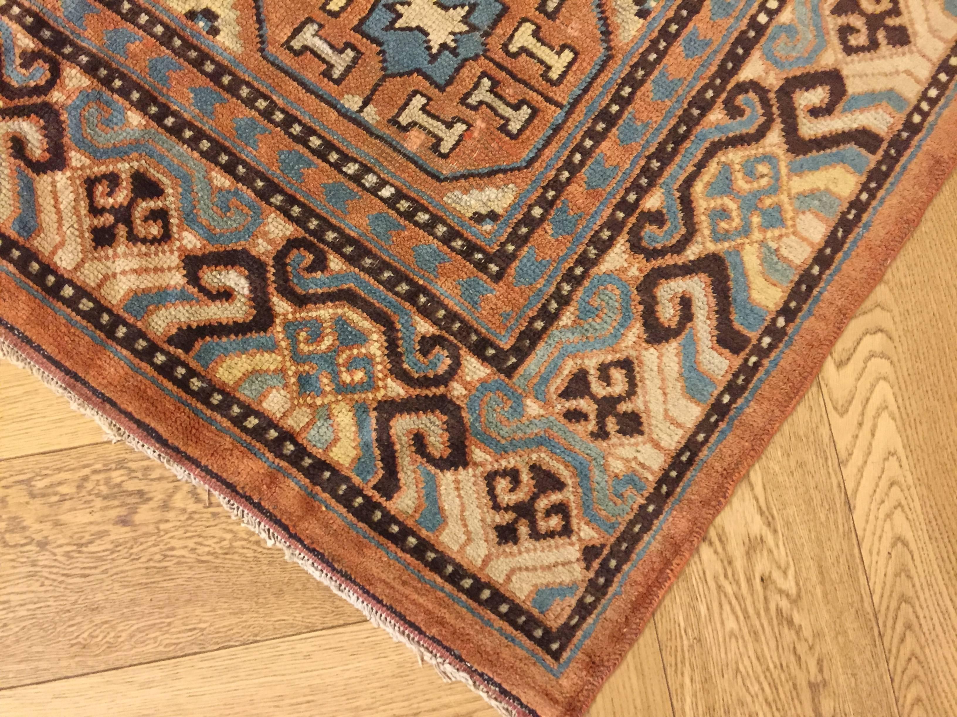 19th Century Brown and Blue Stylized Rosette Gul Chinese Khotan Rug, circa 1870s For Sale 2