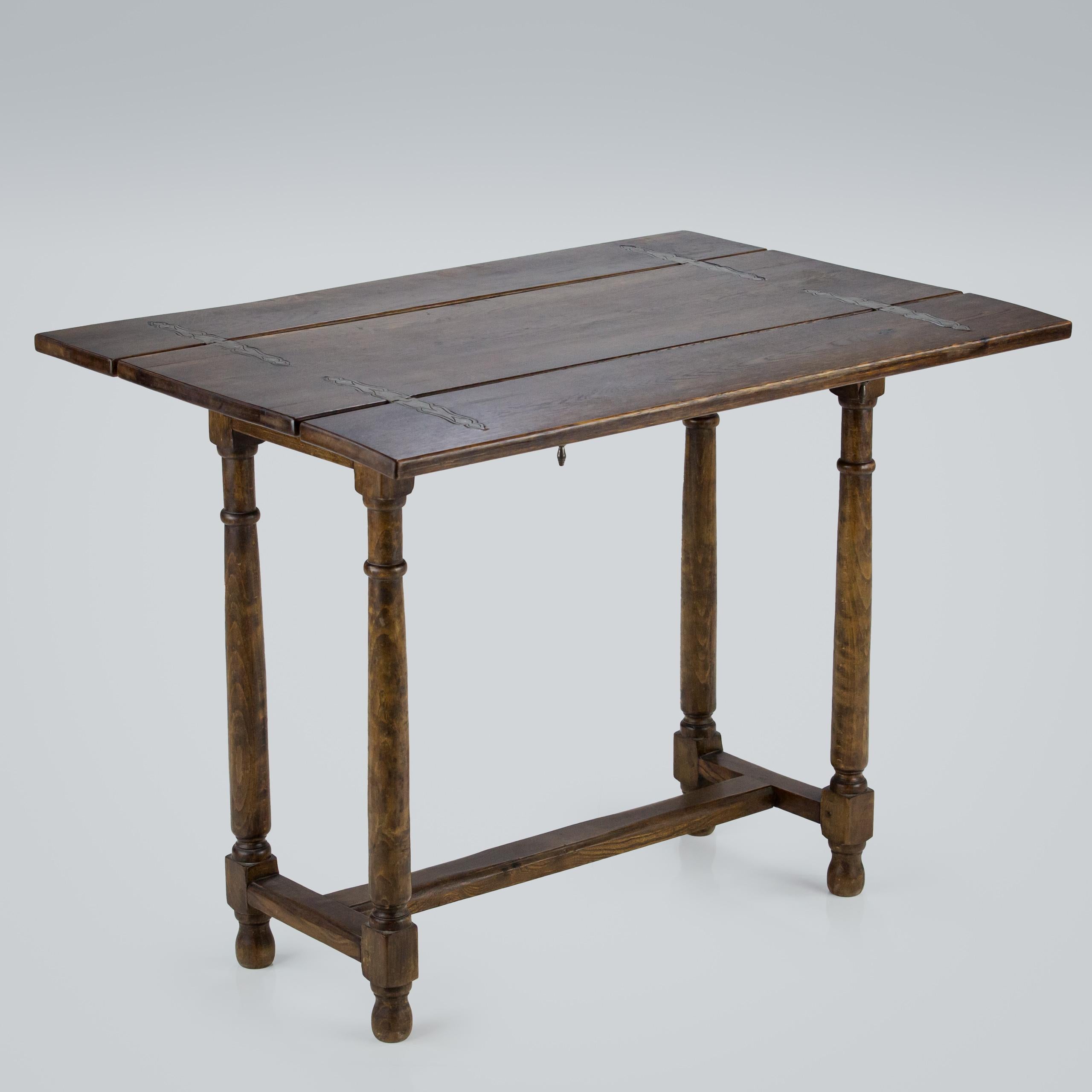 Unusual Console or hunt table, with exceptional ironwork. sits well as a small console table with the ability to open out both leaves when required. Excellent condition France.