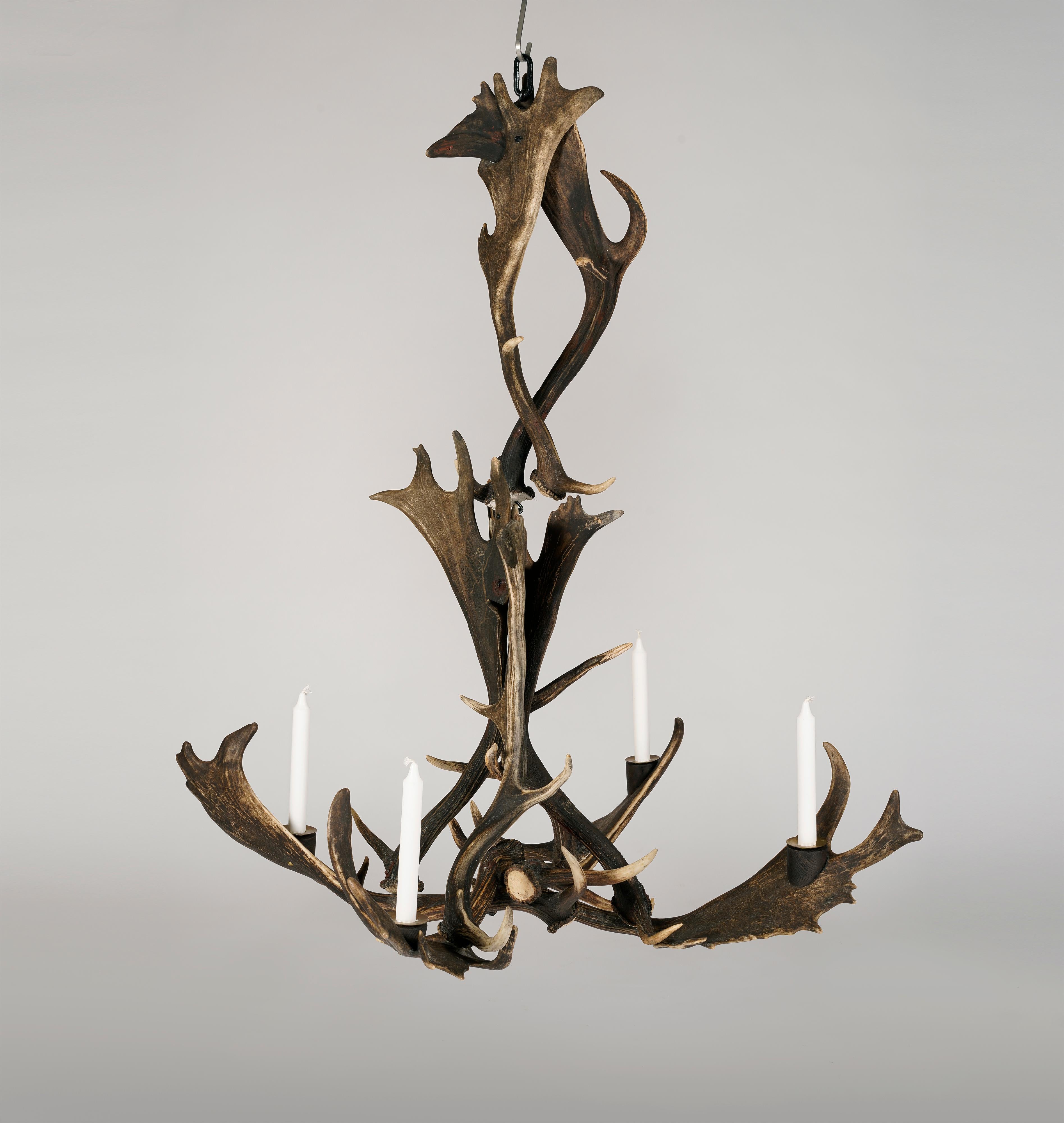 A brutalist Hunter´s Chandelier for four candles. Made in Sweden in the second half of the 20th century of deer horns.

A perfect object to contrast a modern interior.

The chandelier can be divided into two parts for easier transport.

Good