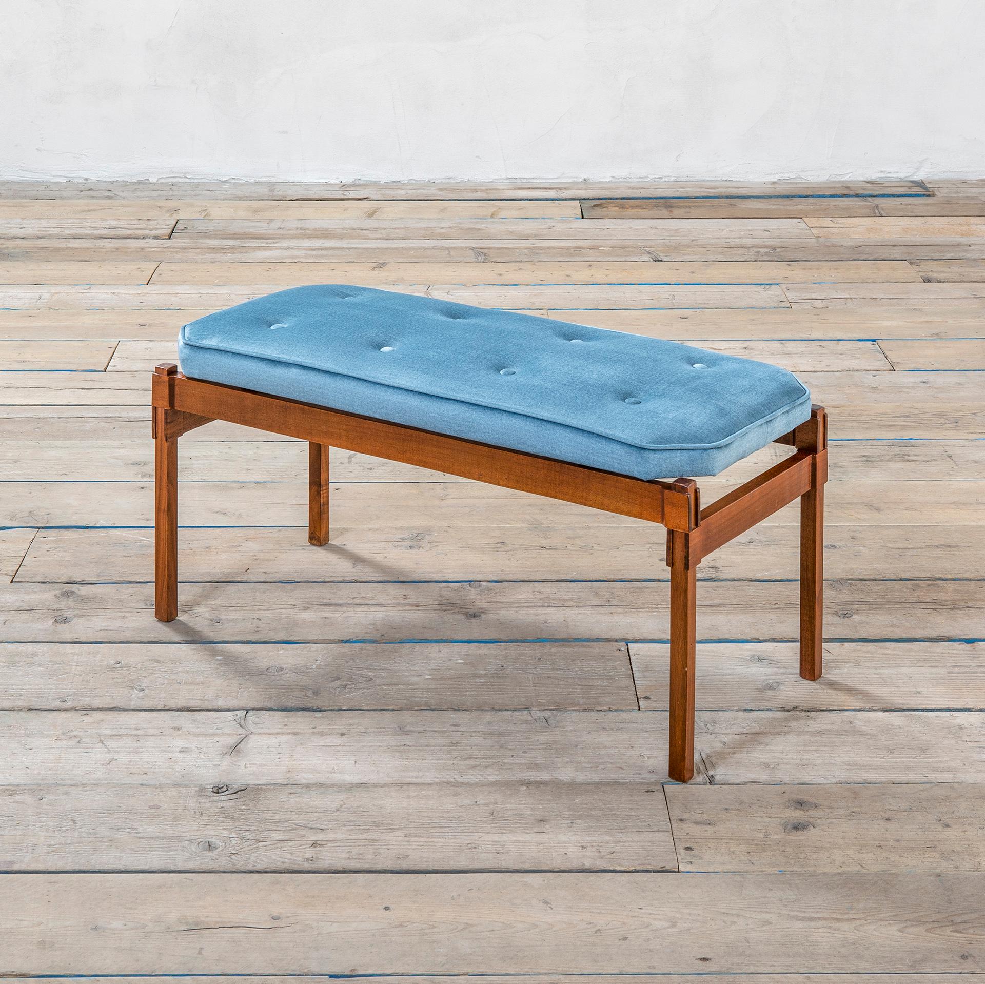 Bench designed by the great Italian master Ico Parisi in '50s. The bench has a wooden structure (teak) with wonderful attention for the corner joints, and the seating is covered by light blue velvet. The upholstery was renewed so you can consider