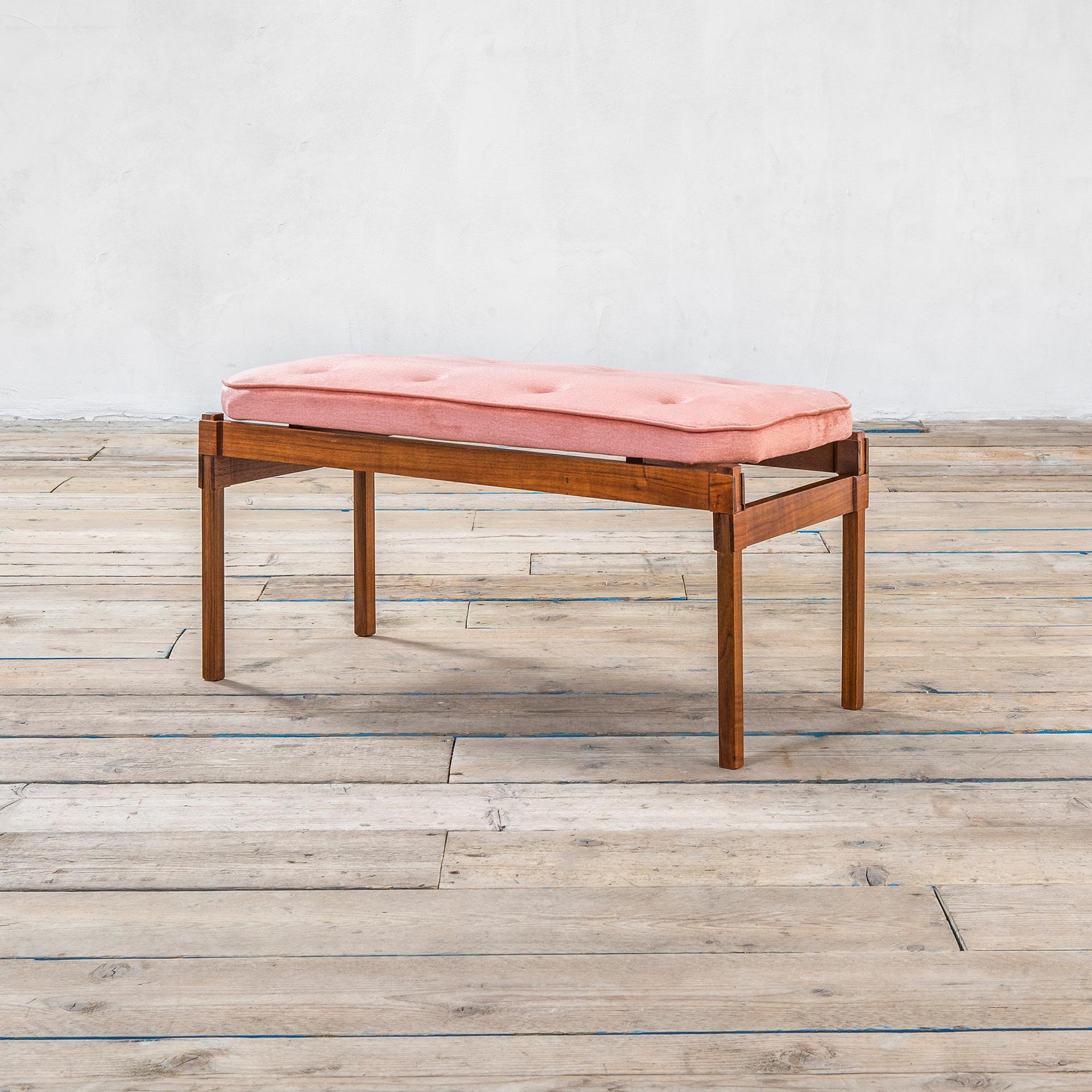 Bench designed by the great italian master Ico Parisi in '50s. The bench has a wooden structure (teak) with wonderful attention for the corner joints, and the seating is covered by pink velvet. The upholstery was renewed so you can consider this