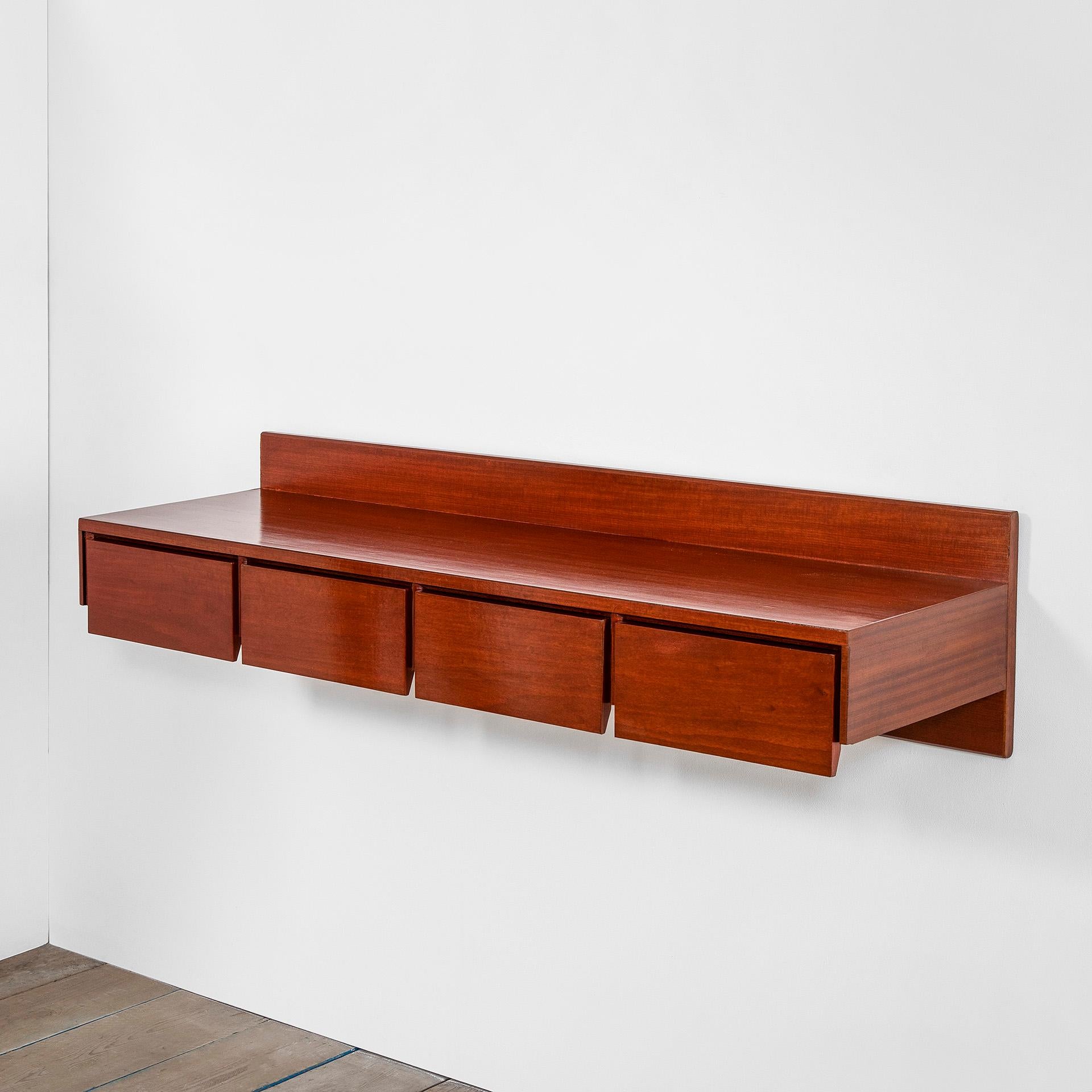 Hanging console designed in 1960s by Ico Parisi for Brugnoli Mobili Cantù. The console is totally in wood and has 3 drawers. Therefore it can be multifunctional: you can put books, ornaments, photoframes upon the long and useful horizontal plane and
