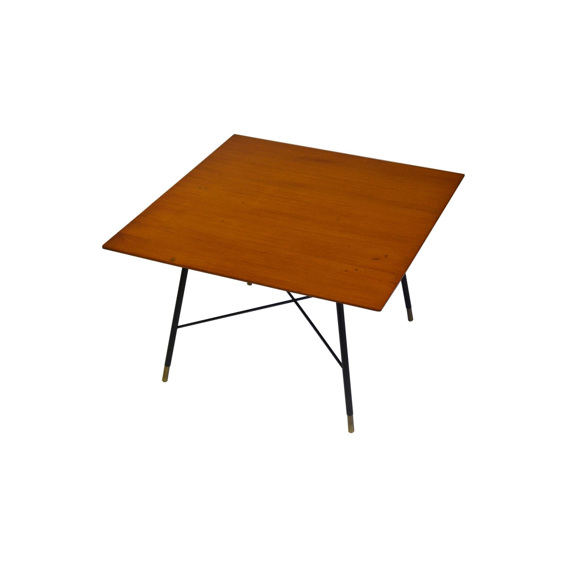 Coffee table designed by Ico Parisi in 1950s. The table has a very simple structure in brass, black coloured with details in golden brass, and a squared wood top.
Very good condition, patina of time.
Published in:
Domus n. 325 of 1956, article