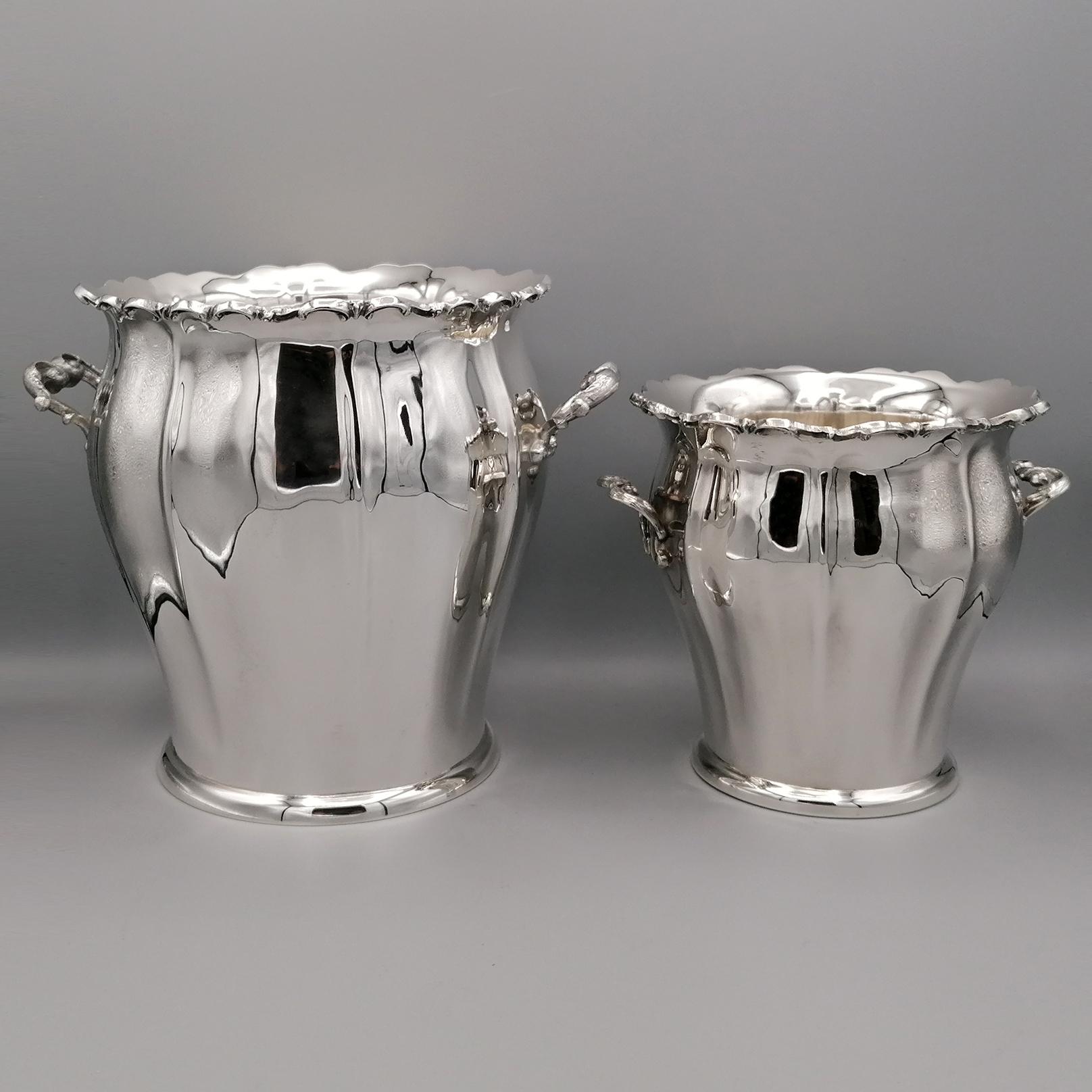 800 solid silver champagne bucket and ice bucket in baroque style.
The body of the buckets was shaped and embossed with ribs typical of the Baroque style.
The handles of the buckets were made with the casting technique and then knurled to make the