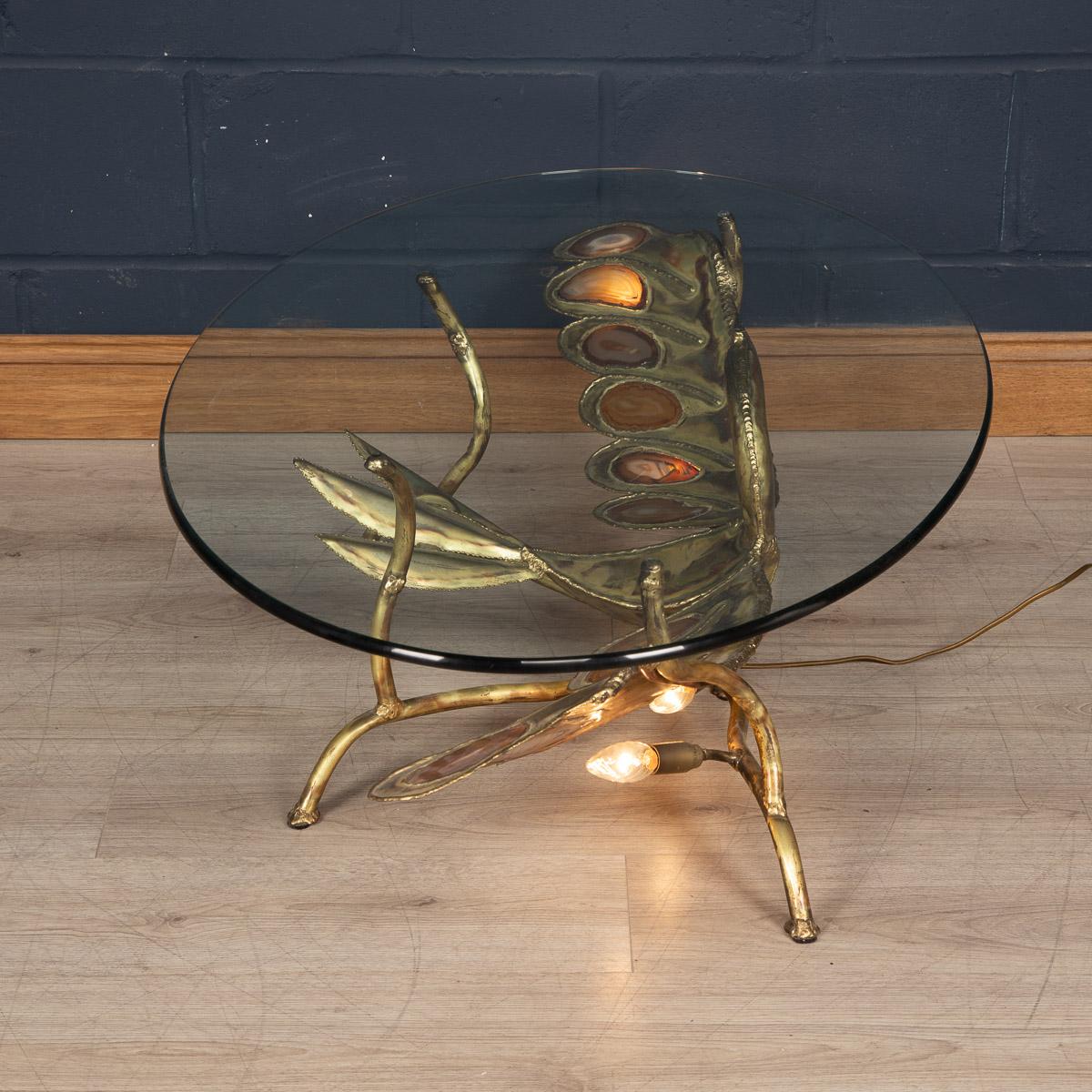 A stunning and striking sculptural coffee table or side table in the form of a butterfly with its wings outstretched. Hand made by the famous designer of the 1970s Henri Fernandez, this item is made largely from quality brass and agate slices, the