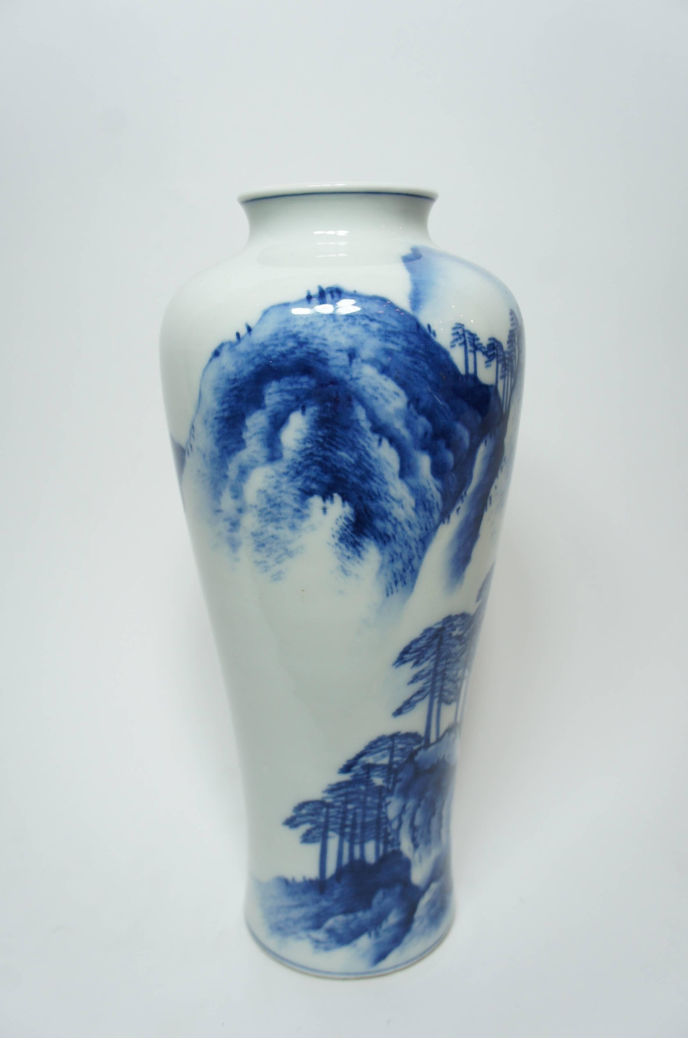 Imari Nabeshima ware vase on which the Chinese style landscape is drawn with indigo blue color. 

The kilns of Arita have formed the heart of the Japanese porcelain industry for many centuries. And Imari Nabeshima ware is one of that.
Nabeshima