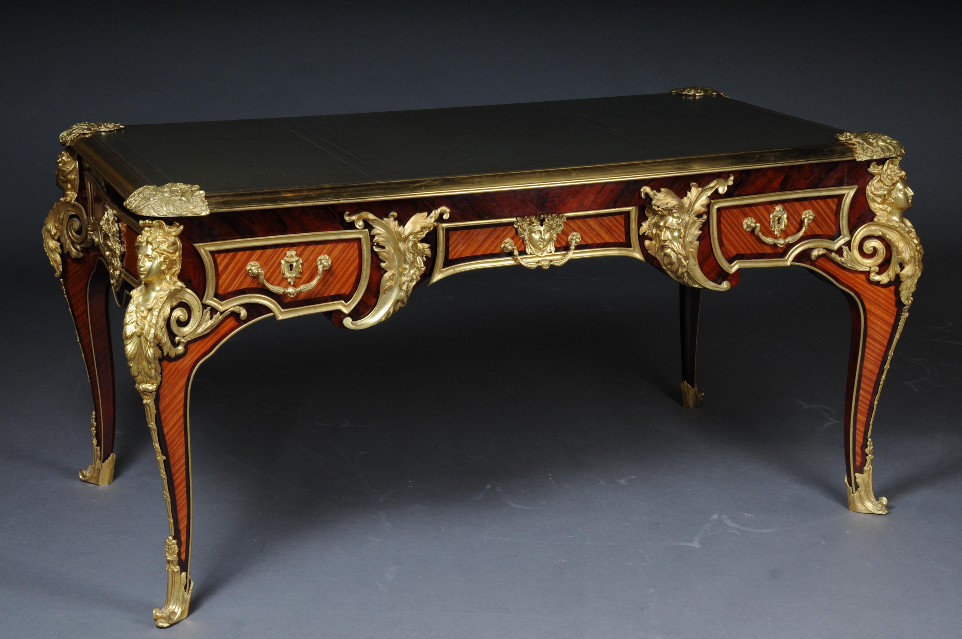 Imperial French bureau plat or desk by Charles Boulle

This model was built by the most important and history-writing court carpenter Louis IV, Charles Boulle.
Polished tulip veneer on solid beech and oakwood. Extremely finely chiseled bronze.