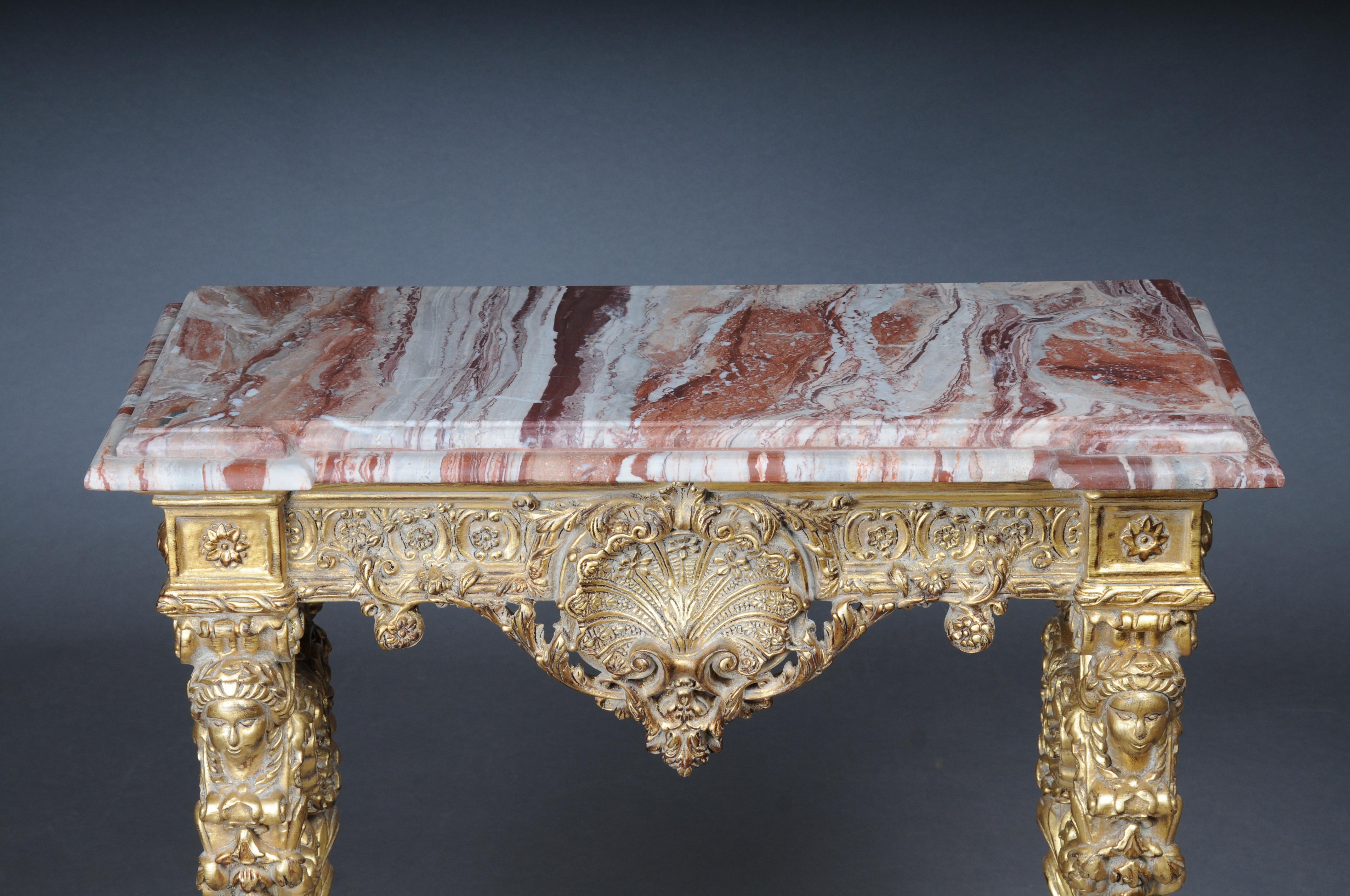 20th Century Impressive wall console gilded with marble, model after F. Linke


Solid beech wood, hand-carved and gilded. Extremely finely carved ornaments. Pronounced frame crowned with shell ornament. Straight legs which are also richly decorated.