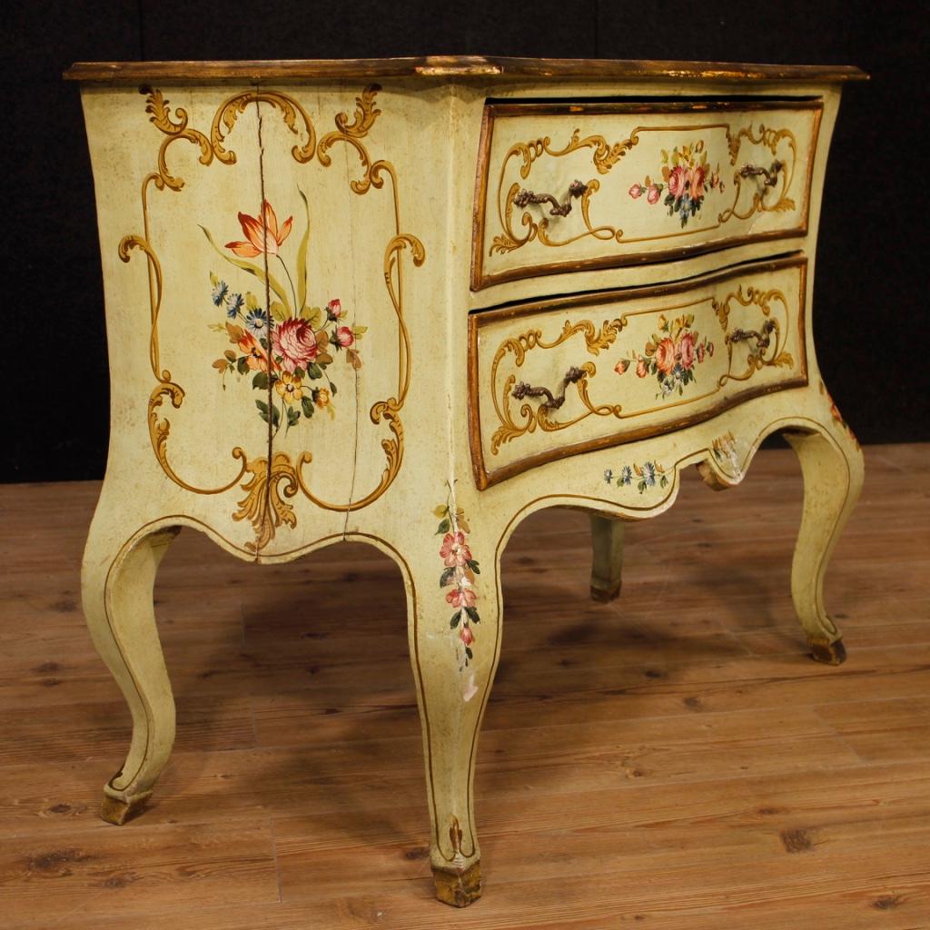 Venetian dresser from 20th century. Furniture in lacquered and painted wood and painted with floral decorations of great pleasure. Chest of drawers with two drawers of good capacity and wooden top in lacquered and painted character (see photo). On