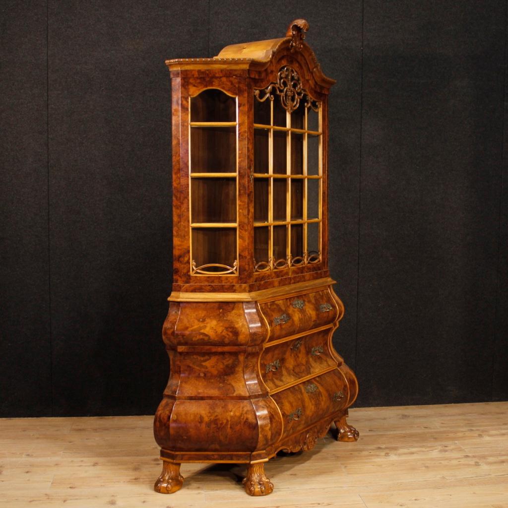 Dutch showcase from the mid-20th century. Furniture carved in walnut, mahogany, burl, maple and beech. Double body display cabinet supported by four feet (see photo). Vitrine equipped with three large drawers at the bottom and one door at the top.