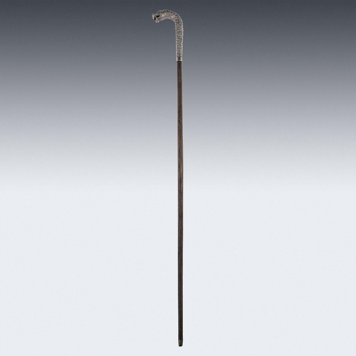 Antique 19th century Indian Kutch (Cutch), Bhuj, (Gujarat region) handcrafted solid silver large cane handle, shaped as a tigers head, decorated all-over with exceptional Cutch chased work, that is distinguished by its closely worked, foliate,