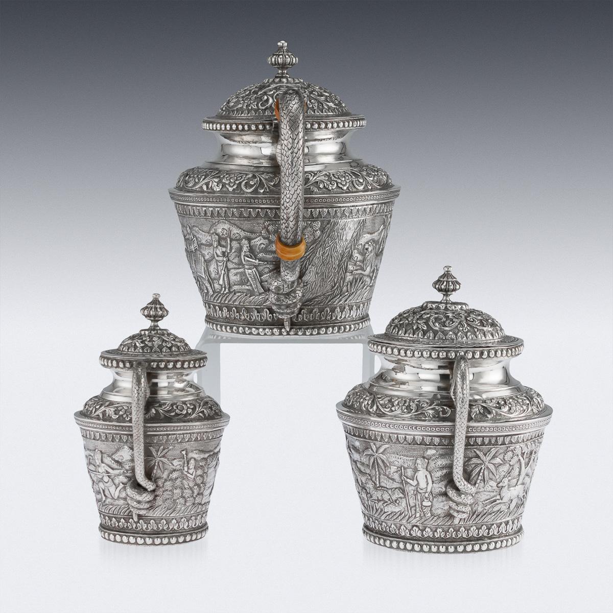 Antique early 20th century exceptional Indian Karachi-Cutch solid silver repousse tea set, comprising of a teapot, lidded sugar bowl and lidded cream jug, each piece is profusely and beautifully repousse' decorated with scrolling foliage, beaded