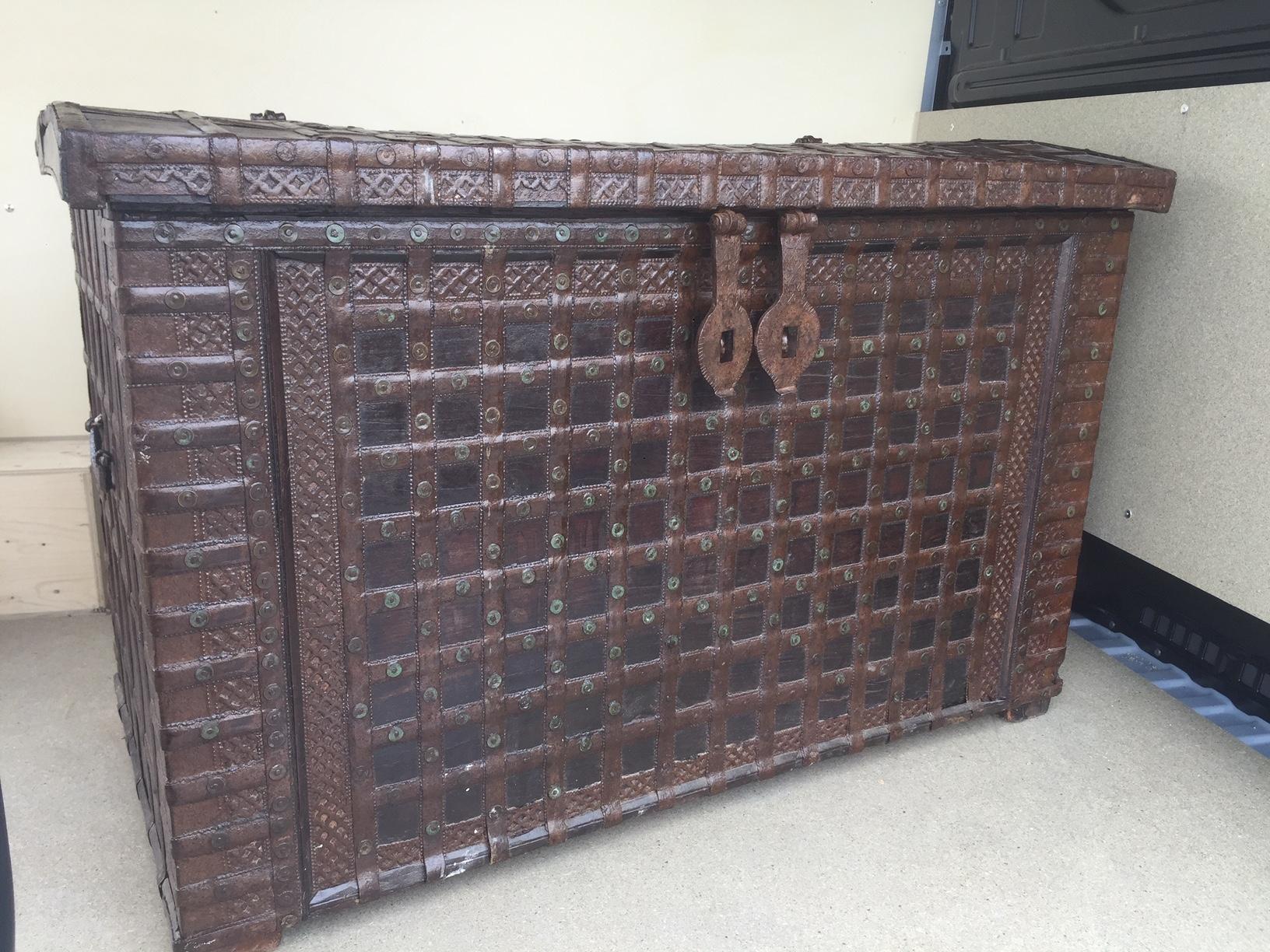Beautiful 20th century Indian large iron and wood trunk. It was a wedding ornate trunk.
Two iron latticework to close the trunk. Two handles on each extremities.