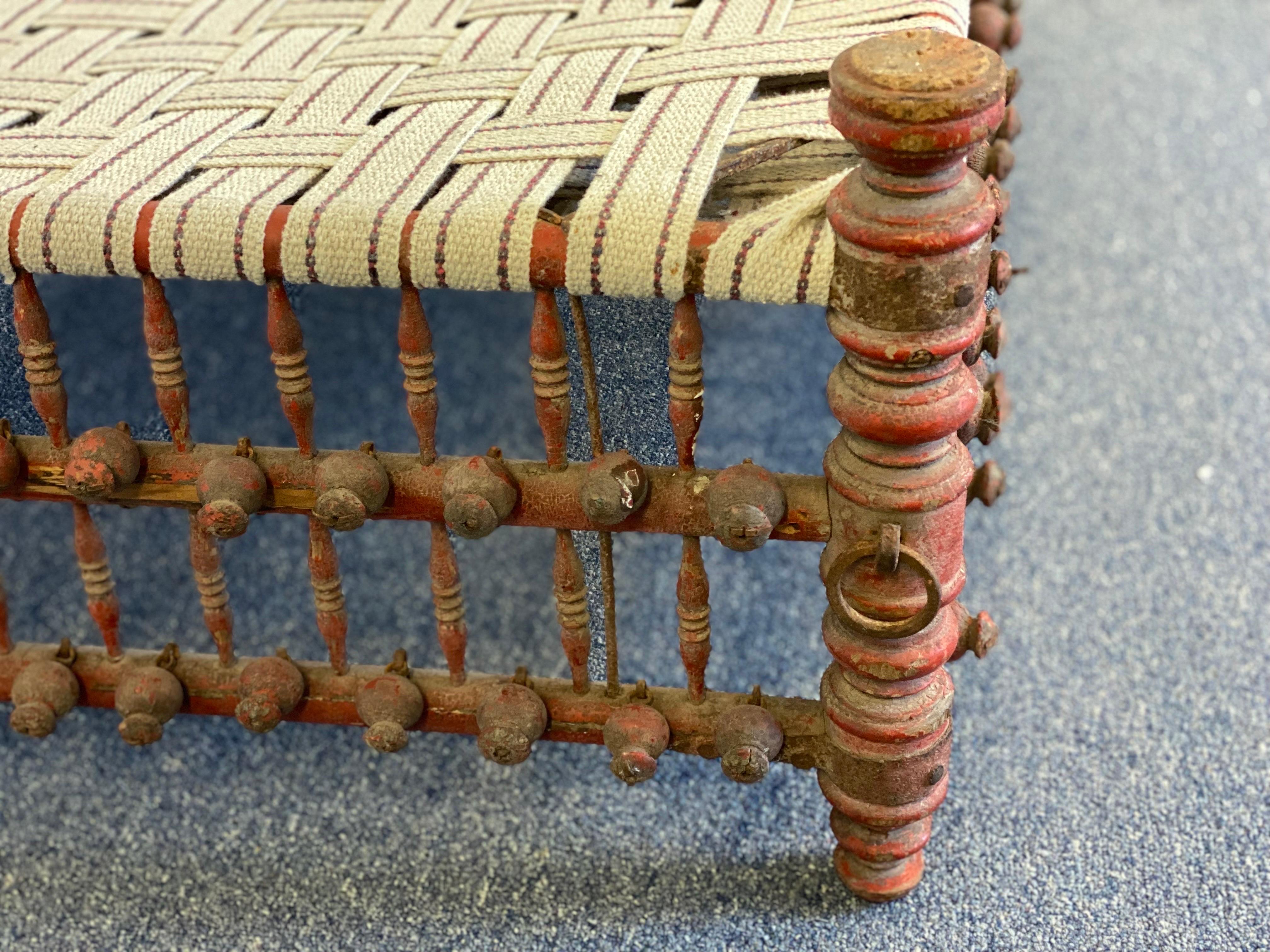 20th Century Indian Red Painted Wooden Ball & Stick Ottoman For Sale 7