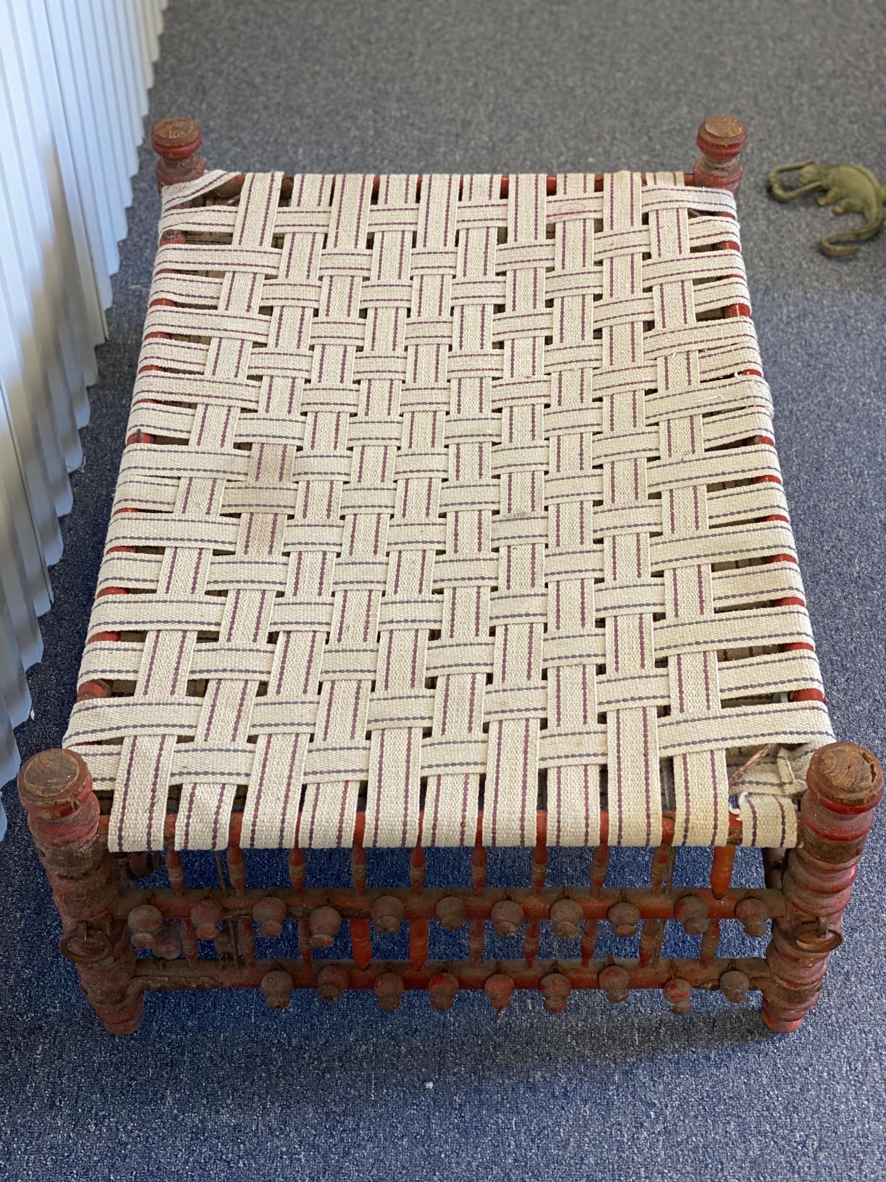 20th Century Indian Red Painted Wooden Ball & Stick Ottoman For Sale 4