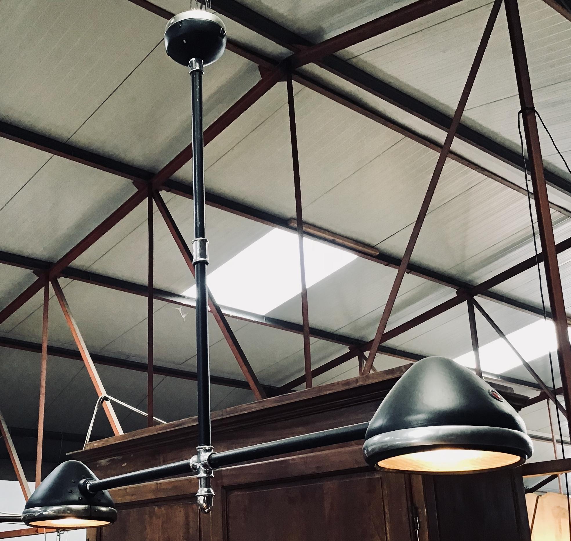 20th century industrial black iron Italian chandelier with two lights.