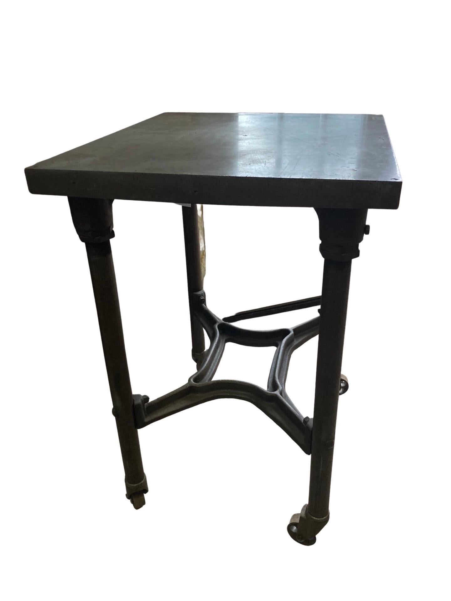 Turtle table built in the early 1900s and originally used in a printing shop in Kansas. This is a beautiful example of American industrial tables, and was used for decades to help business run smoothly. Every part of the table is still original,