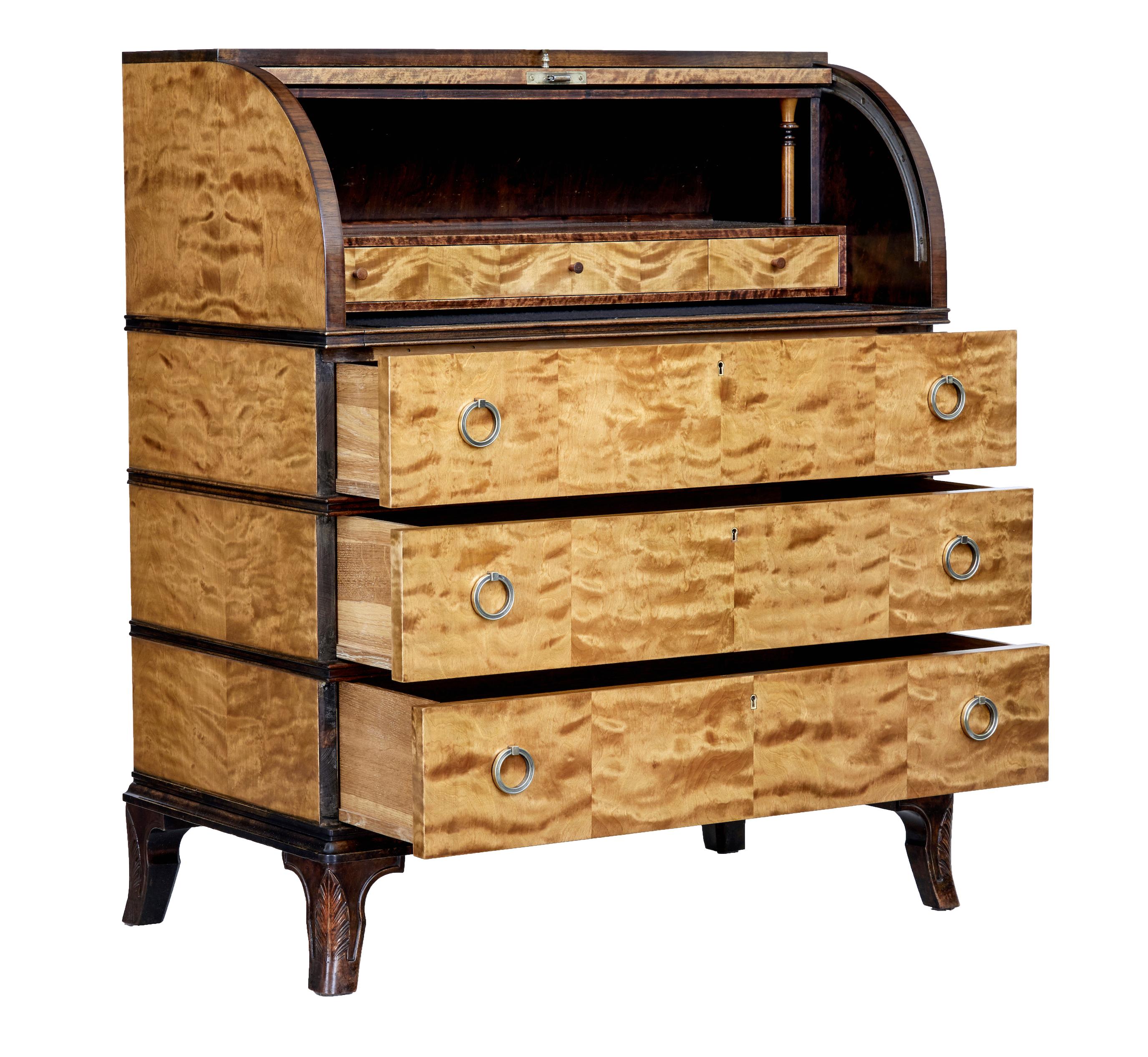 20th century inlaid birch Swedish grace bureau, circa 1930.

Fine example of Swedish grace furniture, typical with its flowing lines with added romantic motifs.

Contrasting dark birch top surface, below which the fall with central matched flame