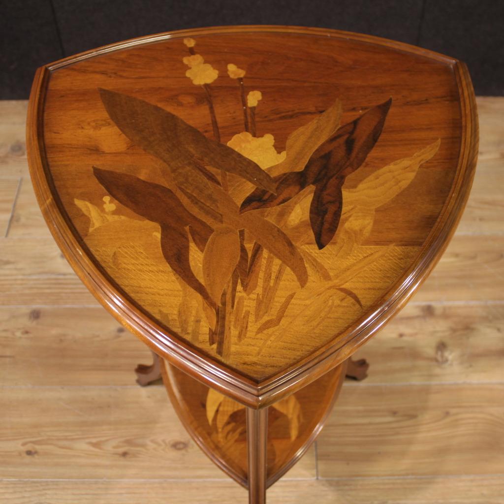 Elegant French side table from the second half of the 20th century. Art Nouveau furniture, finely inlaid in walnut, maple, beech and fruitwood. Side table with a particular shape, equipped with two support surfaces, of good service. Furniture of