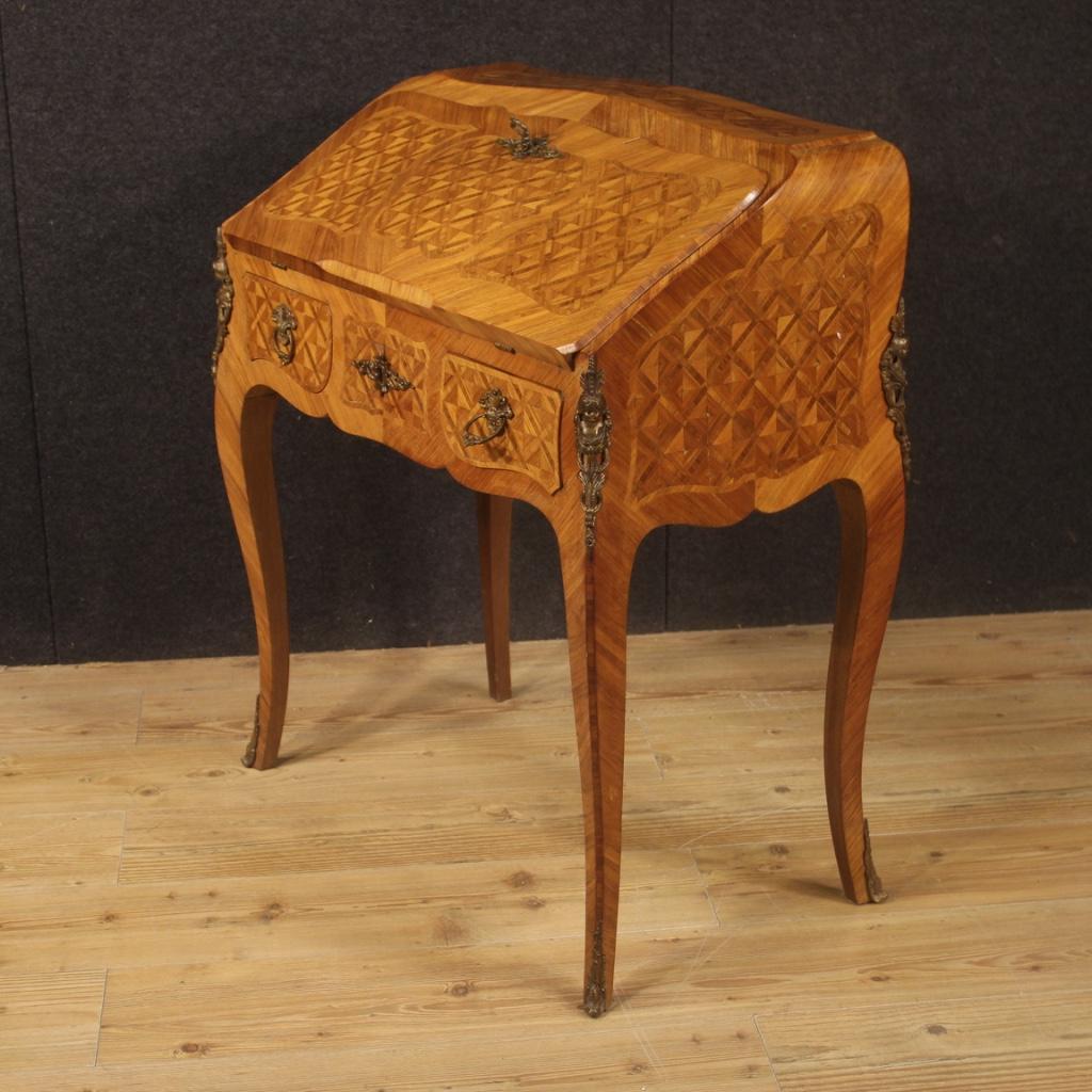 French bureau in the mid-20th century. Furniture adorned with geometric inlay in rosewood, walnut, mahogany and fruitwood. Bureau fitted with two external drawers of good capacity, closable with a special key (central lock). Inside complete with
