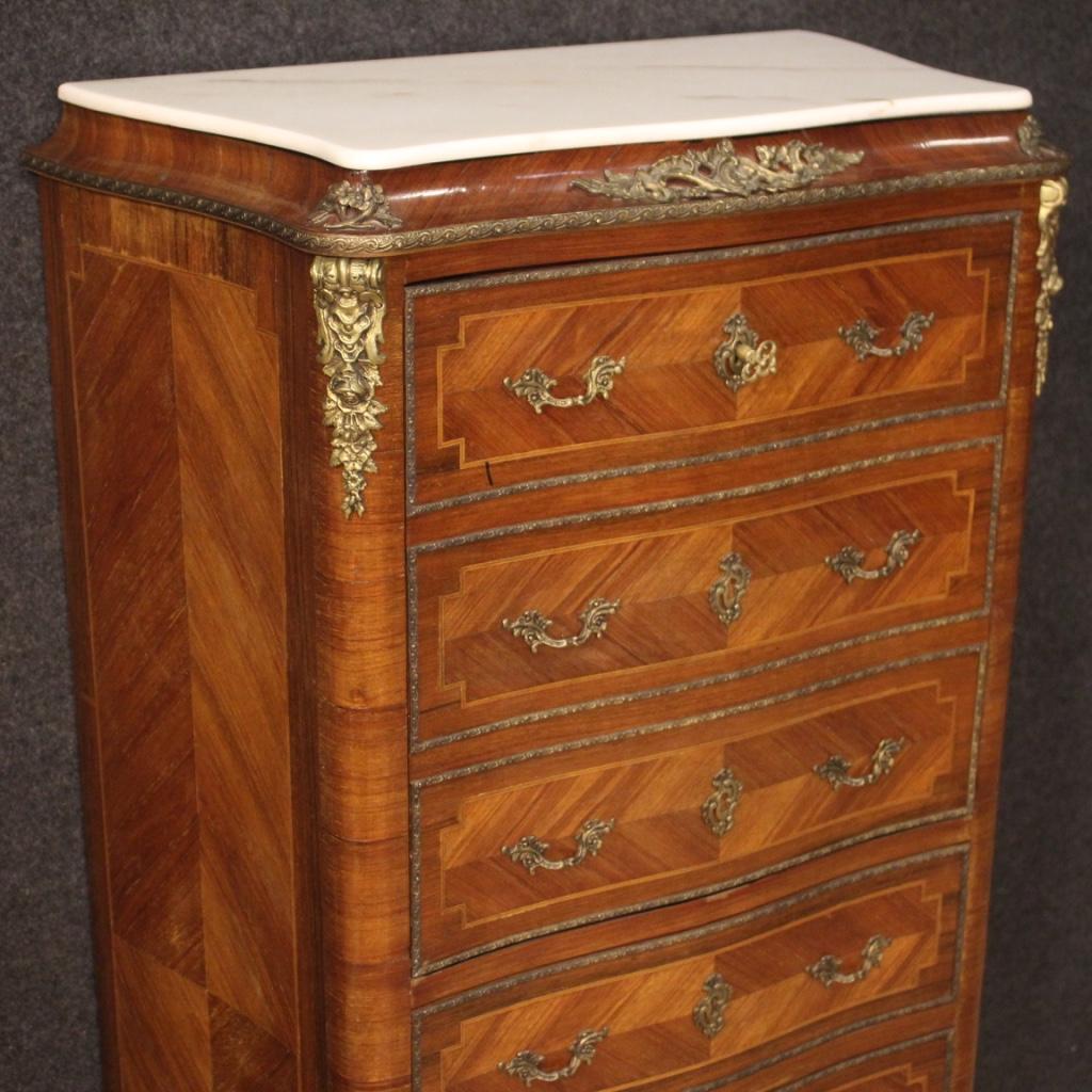 French secrétaire from the mid-20th century. Furniture inlaid in walnut, mahogany, maple and fruitwood richly adorned with gilded and chiseled bronze and brass. Secrétaire equipped with four external drawers (lower part) and fall-front (complete