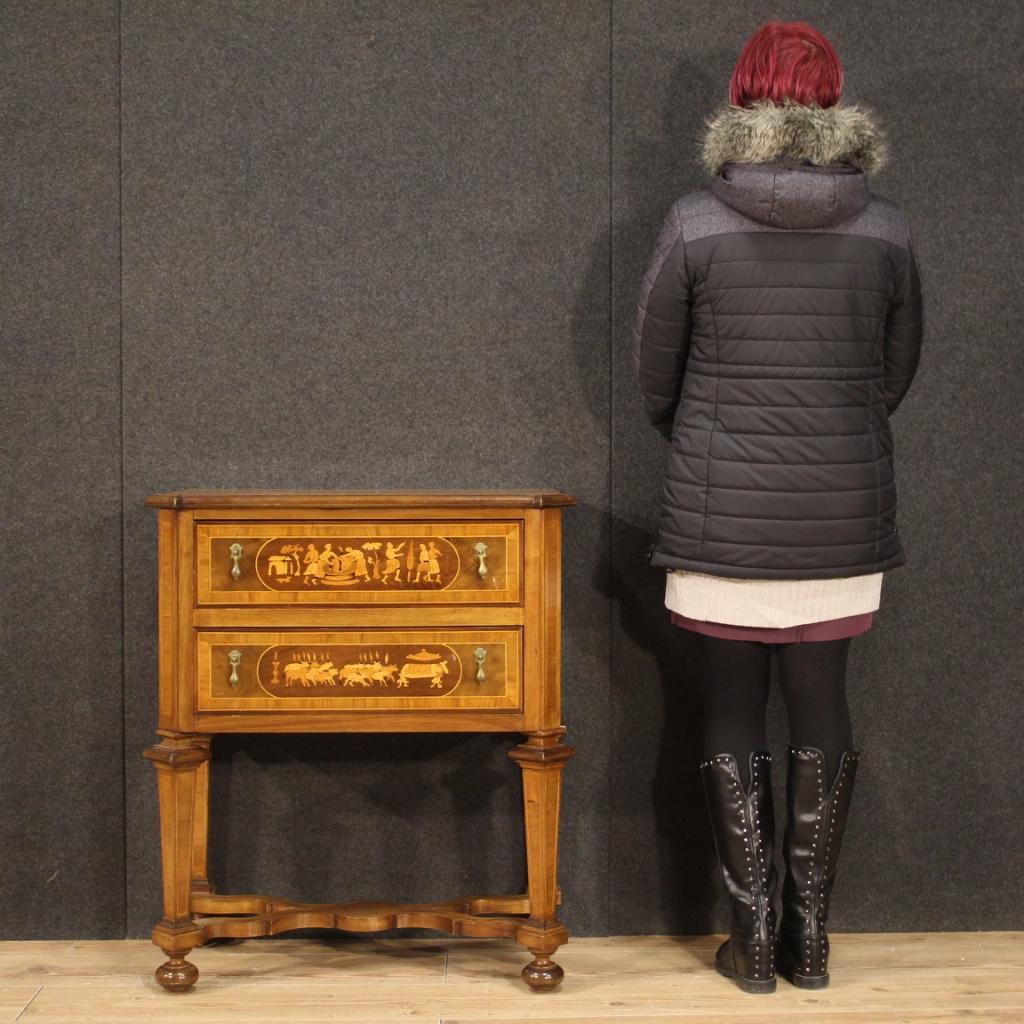 Small Italian commode from the 20th century. Furniture inlaid wood in walnut, maple, beech and fruitwood of beautiful lines and pleasant decor. Chest of drawers equipped with two drawers of good capacity and wooden top in character of good service.
