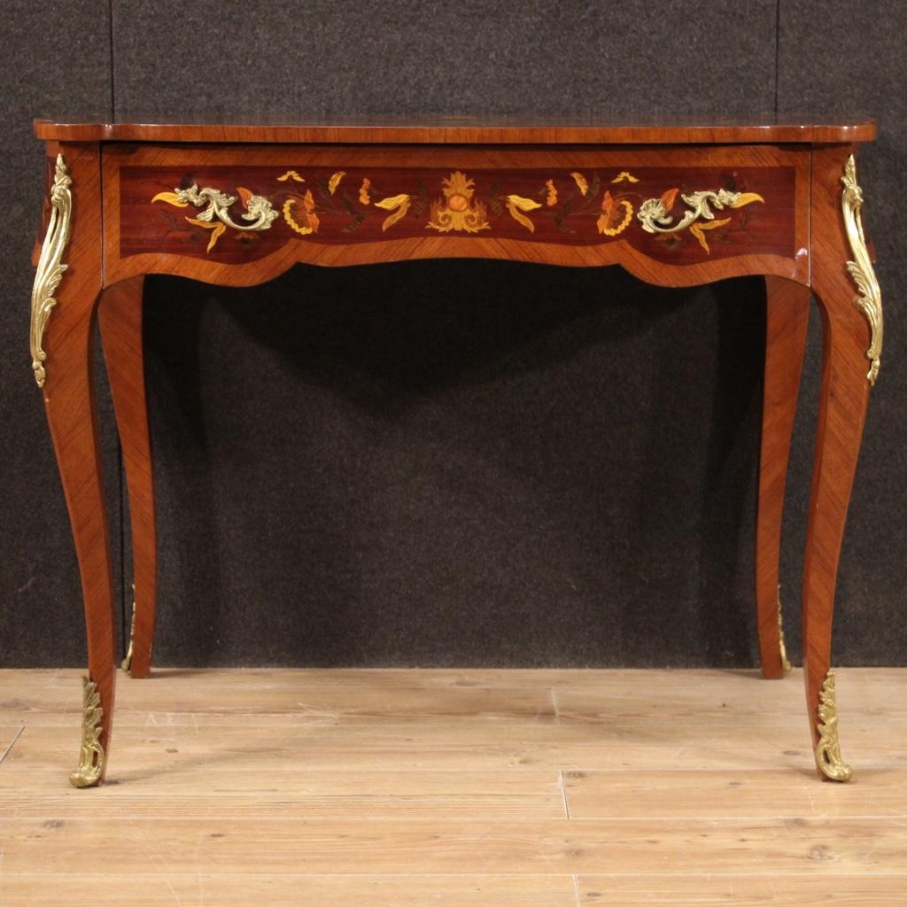 French writing desk from 20th century. Furniture richly inlaid in mahogany, walnut, maple, boxwood, rosewood, burl and fruitwood with floral decorations and musical instruments. Desk of excellent proportion, adorned with handles and decorations in