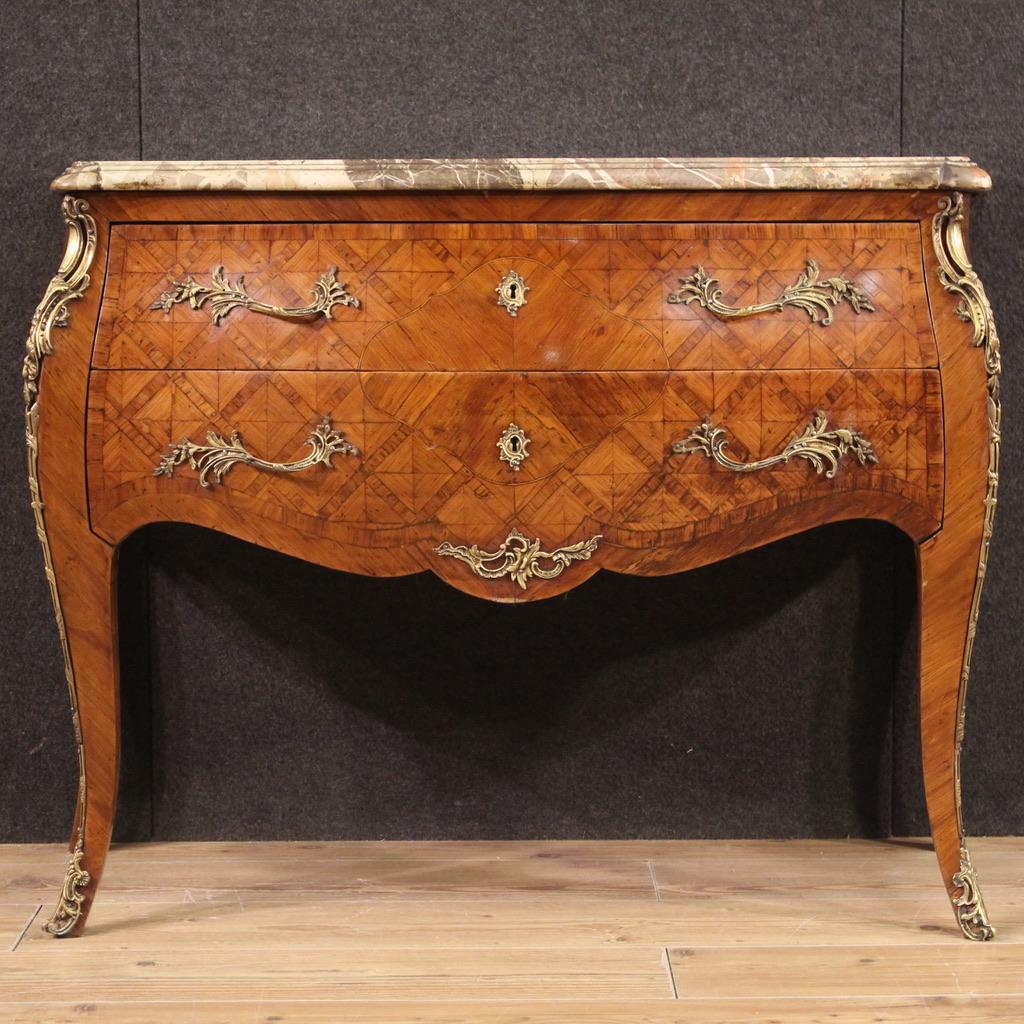 Elegant French chest of drawers from the first half of the 20th century. Wavy and rounded piece of furniture, in Louis XV style, pleasantly adorned with geometric inlay in walnut and maple wood. Dresser equipped with two drawers of good capacity and
