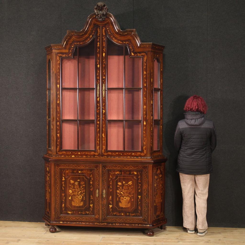 Great Dutch showcase from the second half of the 20th century. Furniture of great size and impact richly inlaid in walnut, maple, palisander, mahogany, ebonized wood, cherry and fruitwood. Double body showcase equipped with two doors in the lower
