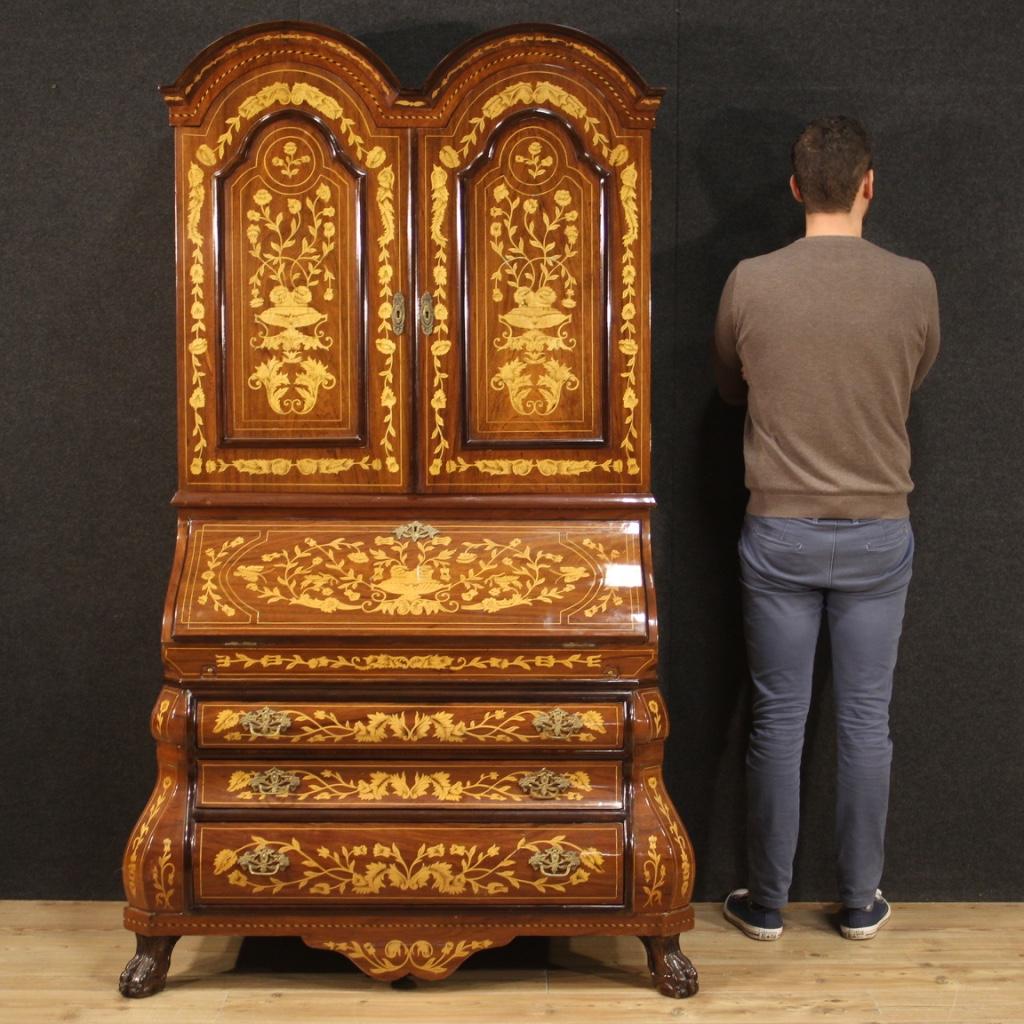 Fabulous 20th century Dutch trumeau. Moved and rounded furniture richly inlaid in walnut, mahogany, beech, maple and fruitwood. Double body trumeau equipped with three external drawers of good capacity. Bureau that offers a good-sized inlaid writing