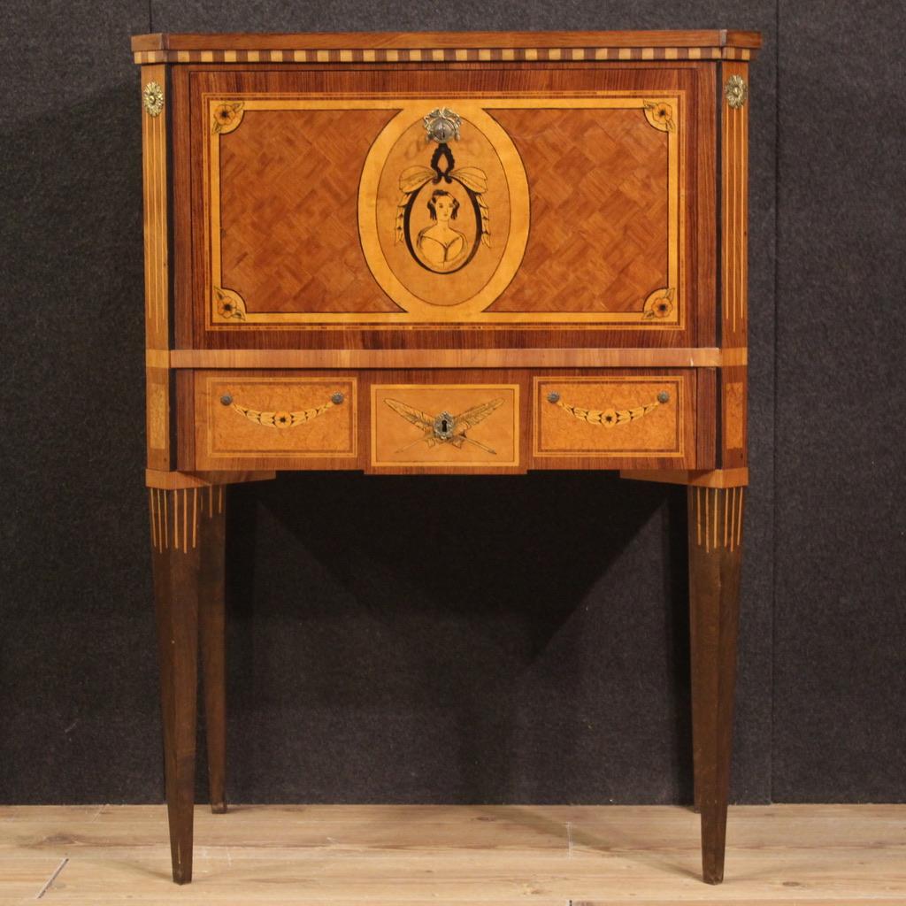 Dutch secretaire from the second half of the 20th century. Louis XVI style furniture pleasantly inlaid in walnut, palisander, maple, rosewood, mahogany, burl, ebonized wood and fruitwood. High-leg secretaire equipped with a front drawer and drawer