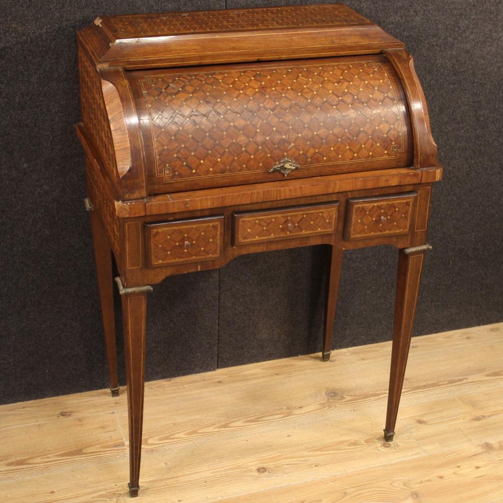 French bureau from the first half of the 20th century. Furniture richly adorned with geometric inlay in walnut, rosewood, palisander and boxwood. Bureau with three external drawers, interior complete with three small drawers and removable top