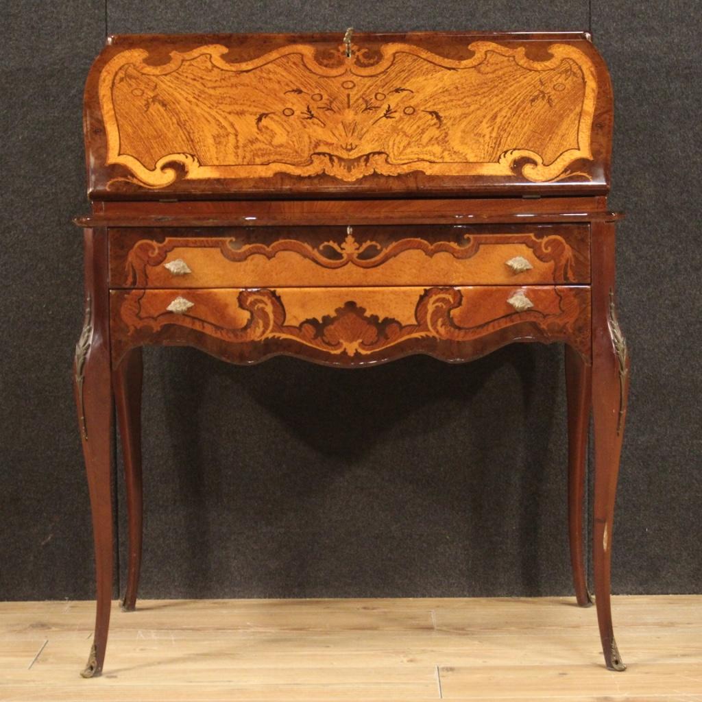 French bureau from the second half of the 20th century. Furniture finished for the center, moved and rounded, inlaid and veneered in walnut, mahogany, burl, beech and fruitwood. High leg desk equipped with two external drawers plus fall-front.