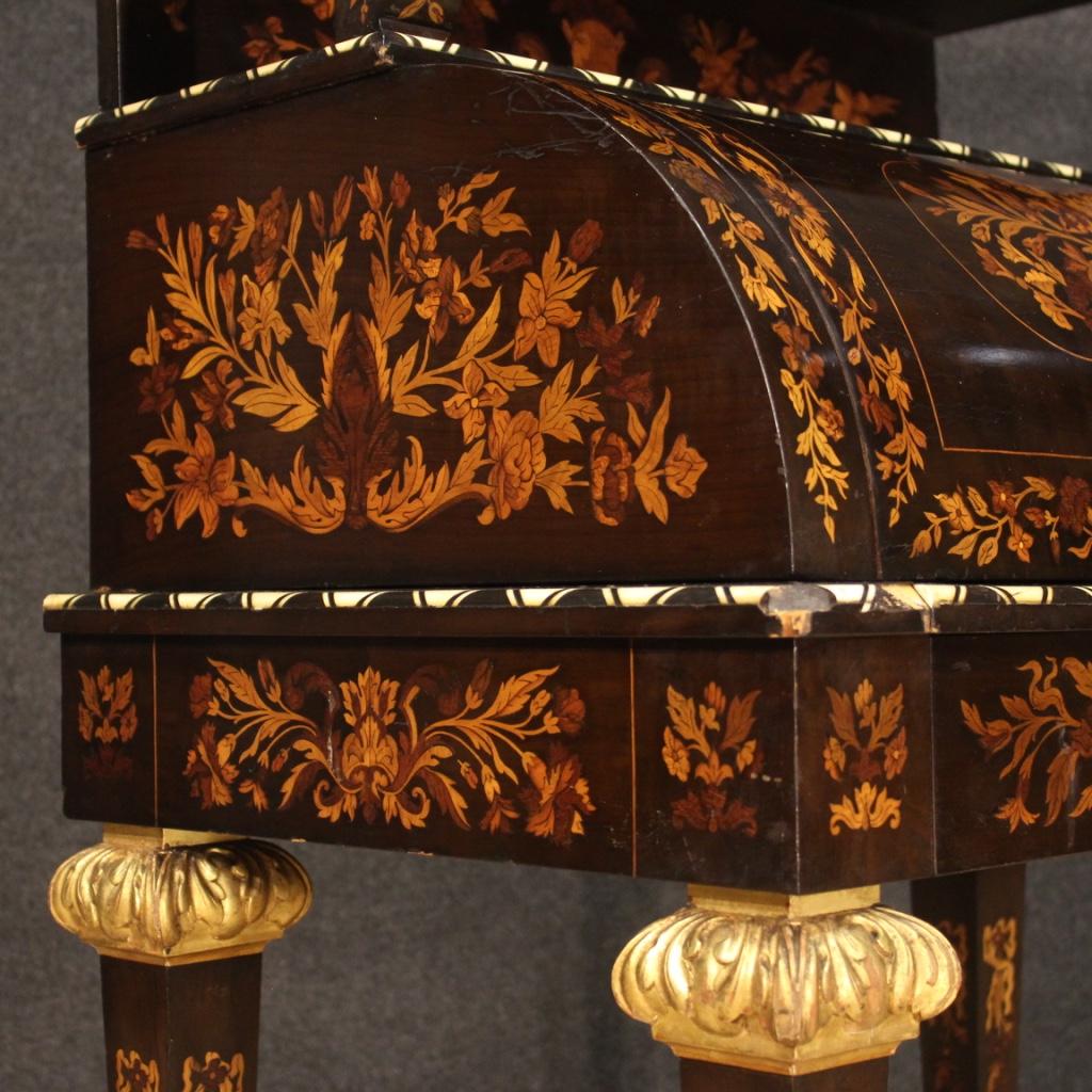 French roll-top bureau from the early 20th century. Napoleon III style furniture richly inlaid with floral decorations in mahogany, walnut, maple, bone and precious woods. Bureau equipped with an external front drawer, retractable desk compartment