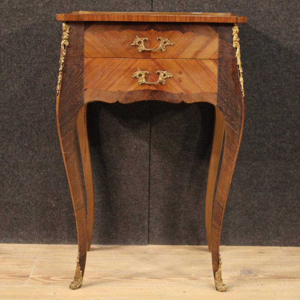 French side table from the mid-20th century. Furniture pleasantly inlaid in walnut, rosewood, palisander and fruitwood with decorations in gilded and chiseled metal. Side table with two front drawers and wooden top in character complete with wooden