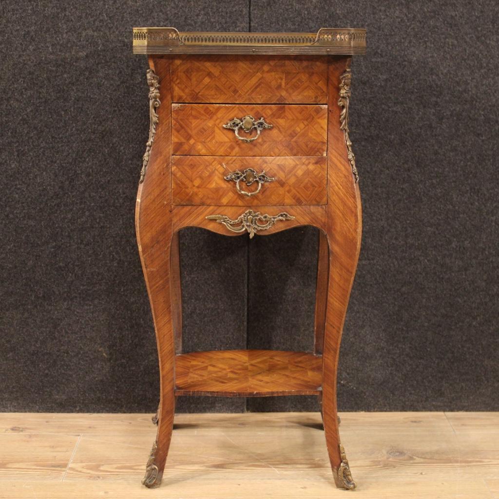French side table from 20th century. Furniture adorned with geometric inlay in rosewood with chiseled brass and bronze decorations. Night stand equipped with two front drawers and one side of good capacity. Wooden top in character complete with