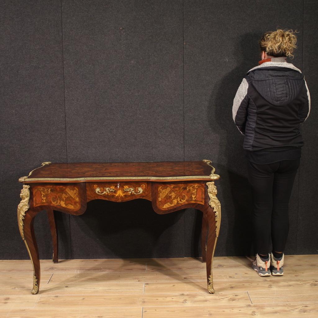 Italian writing desk from the mid-20th century. Wavy and rounded furniture, in Louis XV style, pleasantly inlaid in walnut, palisander, mahogany, rosewood and fruitwood. Desk finished from the center, of beautiful line and proportion, richly adorned