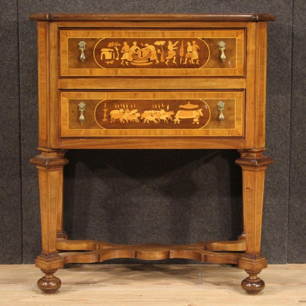 Small Italian commode from the 20th century. Furniture in inlaid wood in walnut, maple, beech and fruitwood of beautiful lines and pleasant decor. Chest of drawers equipped with two drawers of good capacity and wooden top in character of good