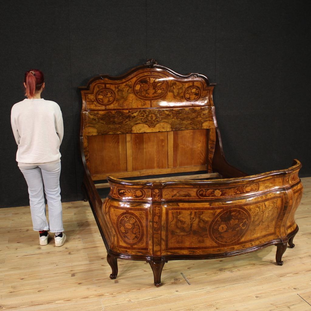 Lombard double bed from the mid-20th century. Louis XV style furniture finely inlaid with floral decorations in walnut, burl, rosewood, maple, ebonized wood and fruitwood, of excellent quality. Wavy and curved bed of fabulous decoration, for antique