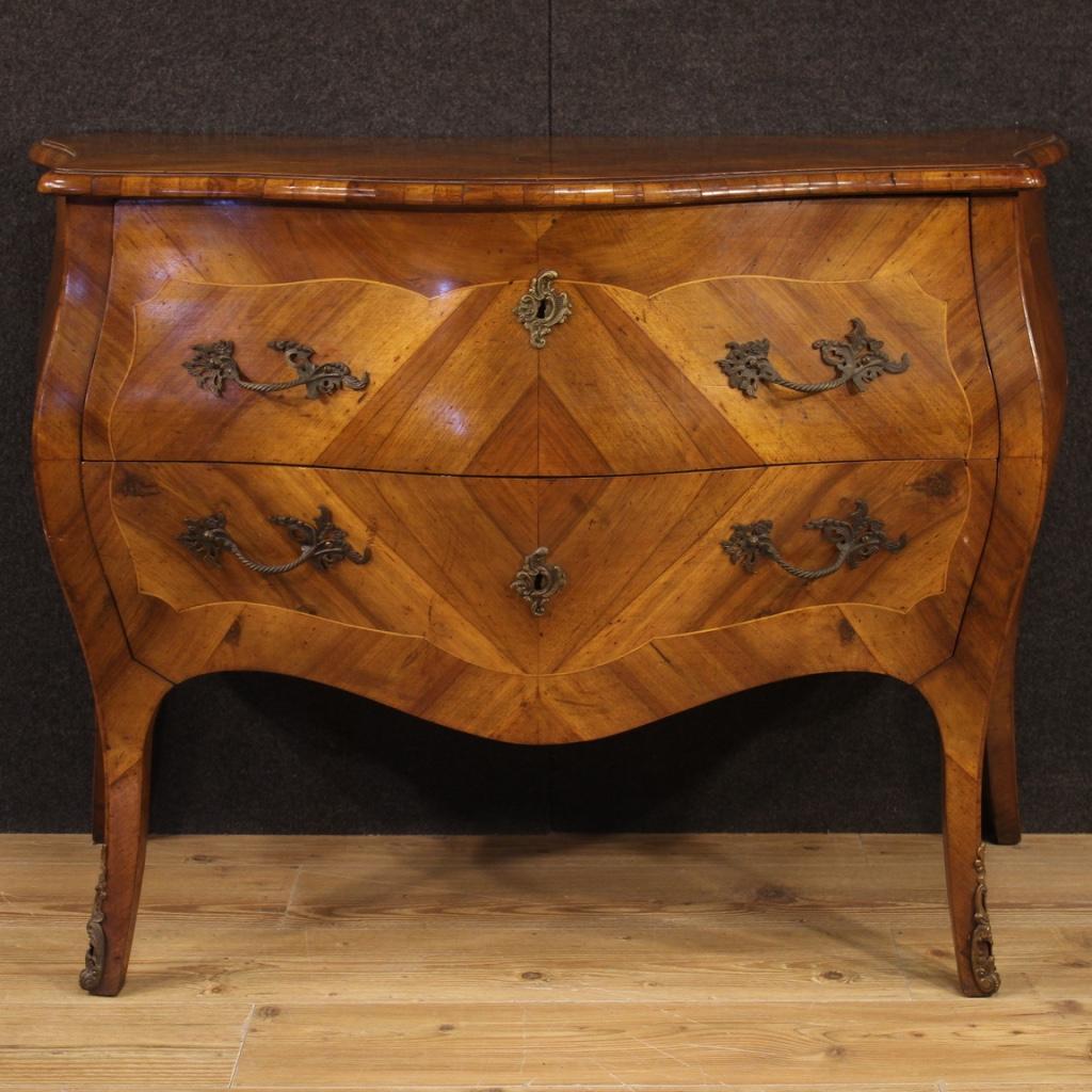 Italian dresser from the mid-20th century. Moved and rounded furniture in Louis XV style veneered and inlaid in walnut and boxwood. Dresser of beautiful line and pleasant decor with two drawers and wooden top in character, of good size and service.
