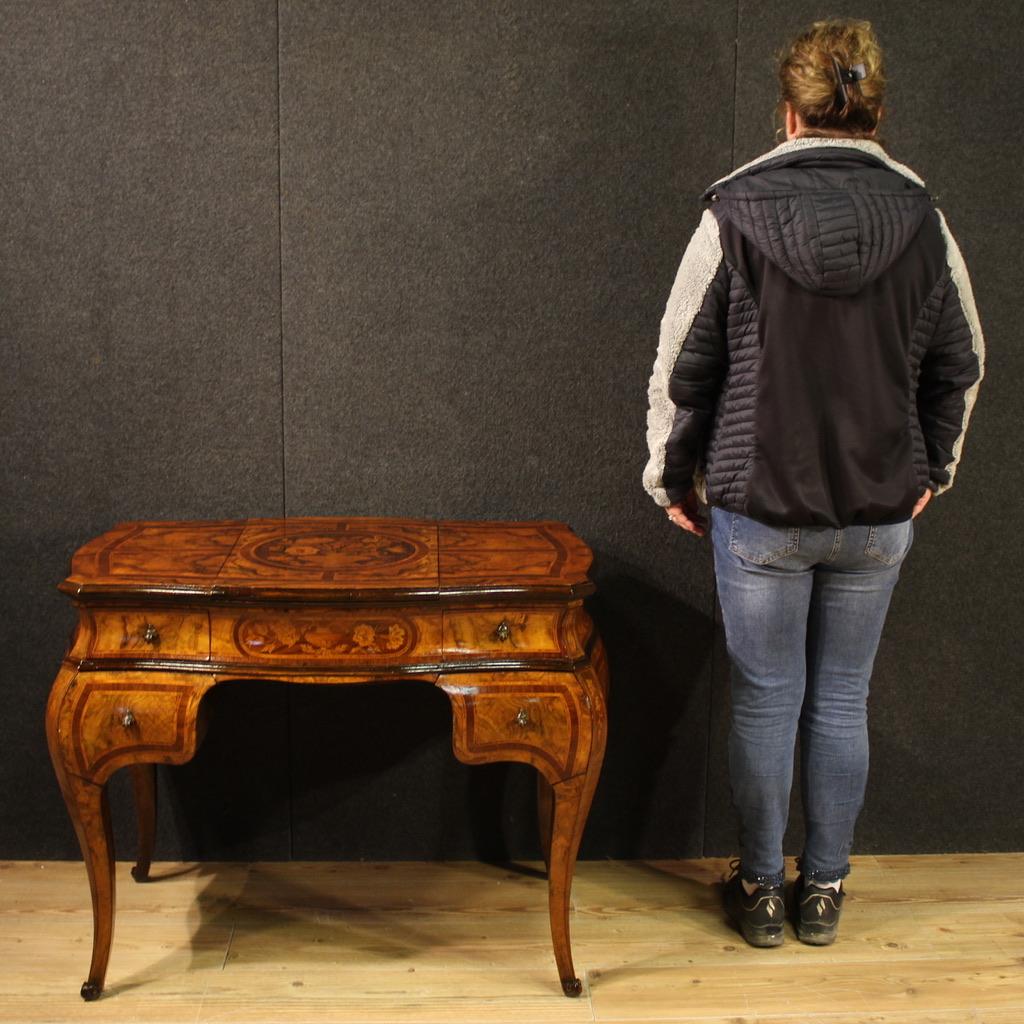 Lombard dressing table from the mid-20th century. Finished for the centre furniture, curved and rounded in Louis XV style, inlaid with floral decorations in walnut, burl, rosewood, maple, ebonized wood and fruitwood. Dressing table with four front