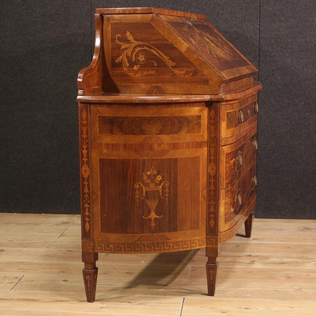 Italian bureau from the mid-20th century. Furniture moved on the front and on the sides richly inlaid in Louis XVI style in walnut, rosewood, maple, burl, palisander and fruitwood. Halfmoon-shaped bureau, of particular shape and proportion, equipped