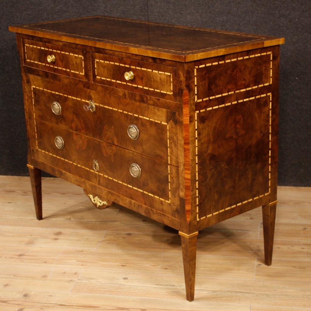 20th century Italian dresser. Louis XVI style furniture inlaid in walnut, maple, boxwood and rosewood. Chest of drawers with two small and two larger drawers of excellent capacity and service. Wooden top in character also nicely inlaid. Furniture