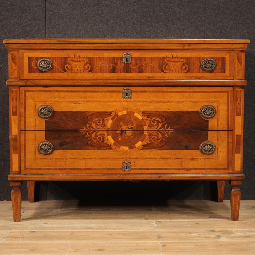 Italian chest of drawers from the second half of the 20th century. Furniture in Louis XVI style pleasantly inlaid in walnut, maple, cherry, beech and fruitwood. Dresser equipped with three front drawers of good capacity. Wooden top also inlaid of