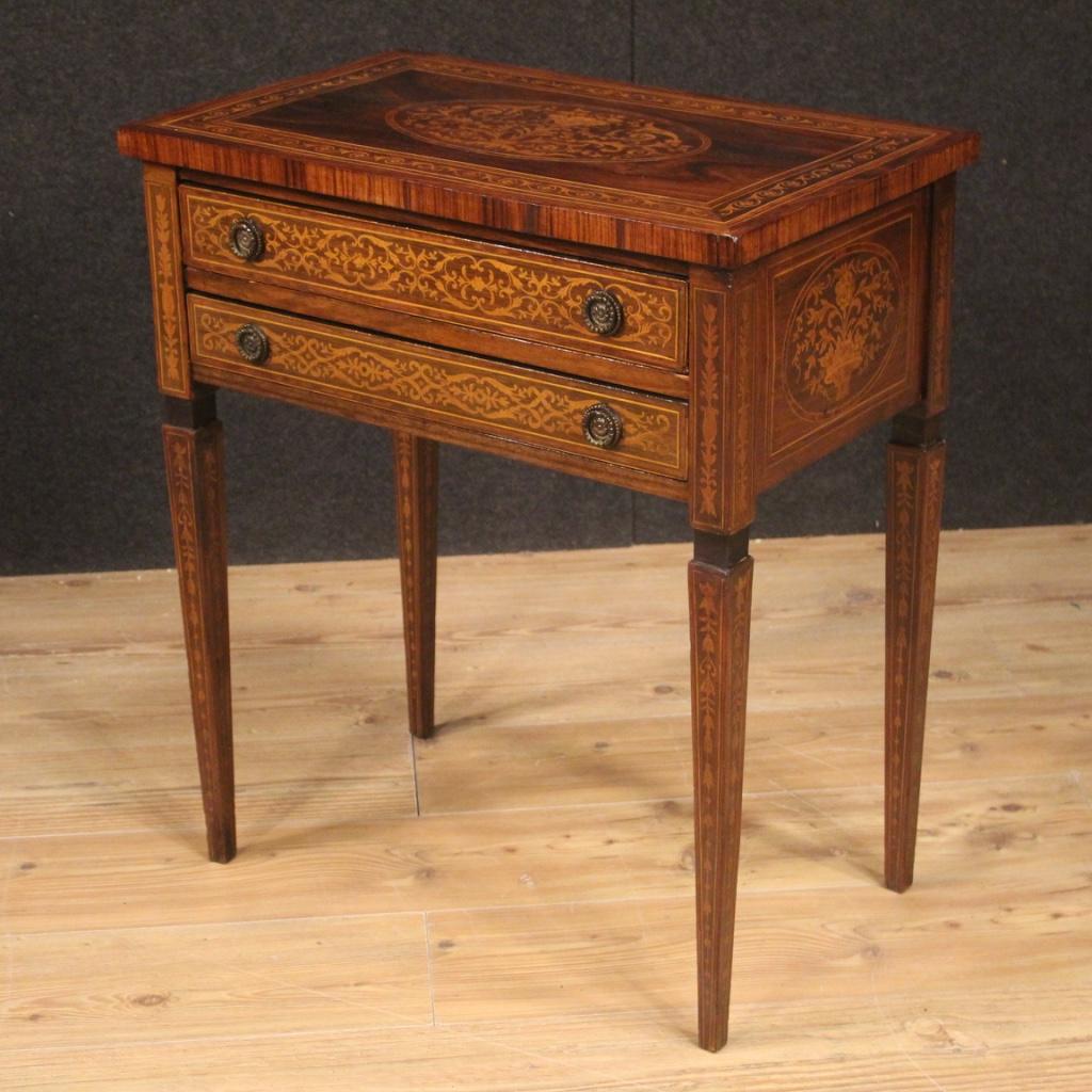 Italian side table from the mid-20th century. Louis XVI style furniture finished for the center richly inlaid in walnut, palisander, maple, mahogany and fruitwood. Side table equipped with two front drawers of discrete capacity and wooden top in