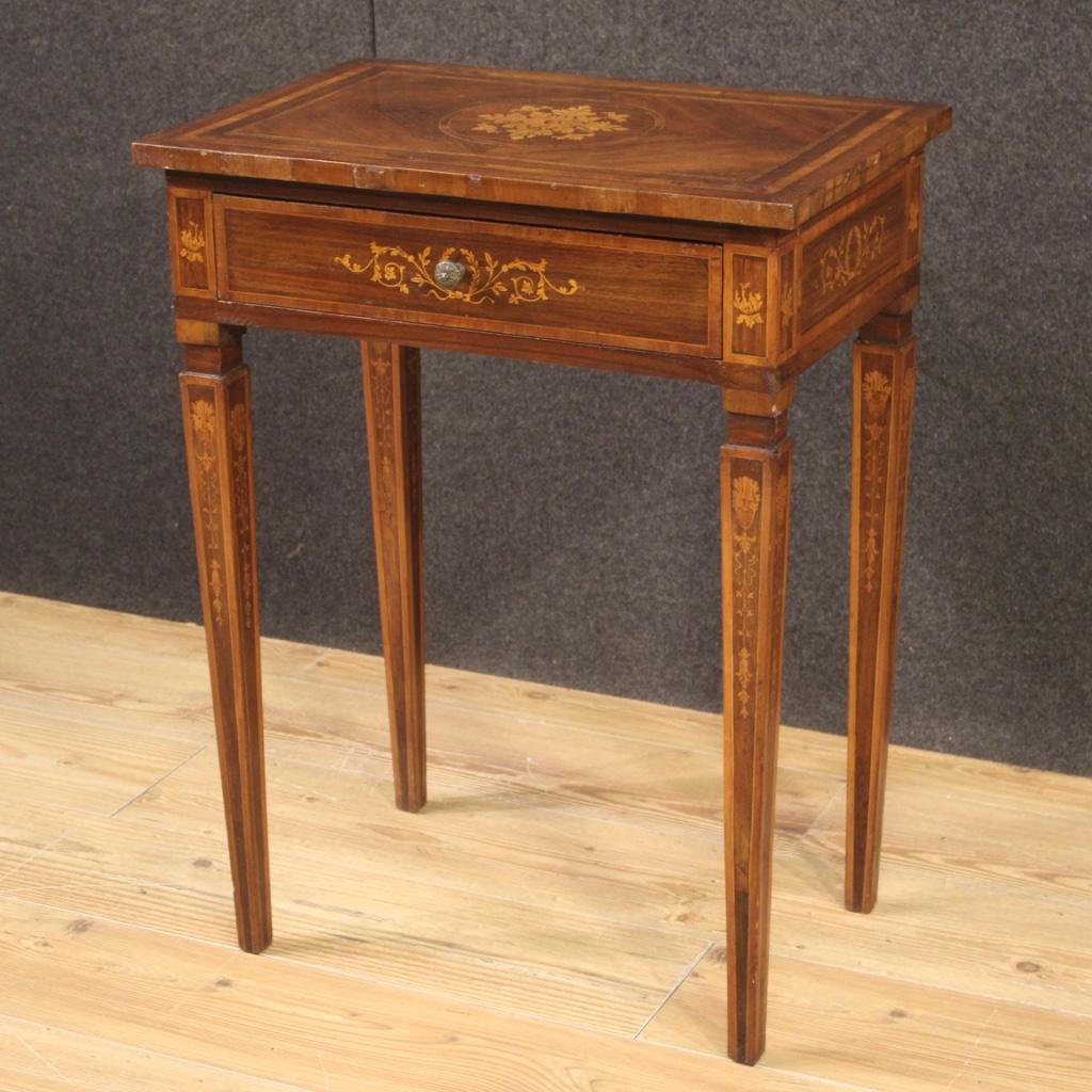 Italian side table from 20th century. Furniture inlaid and veneered in walnut, maple and fruit woods in Louis XVI style. Side table finished from the center equipped with a front drawer and wooden top in character of good size and service. Furniture