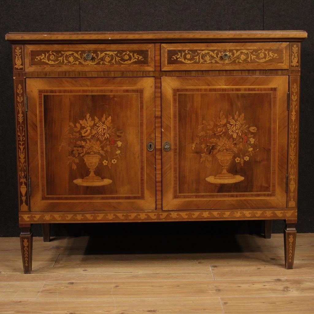 Italian sideboard from 20th century. Louis XVI style furniture richly inlaid in walnut, mahogany, maple, bois de rose, ebonized wood, cherry and fruitwood. Sideboard with two doors and two drawers of good capacity and service with wooden top in