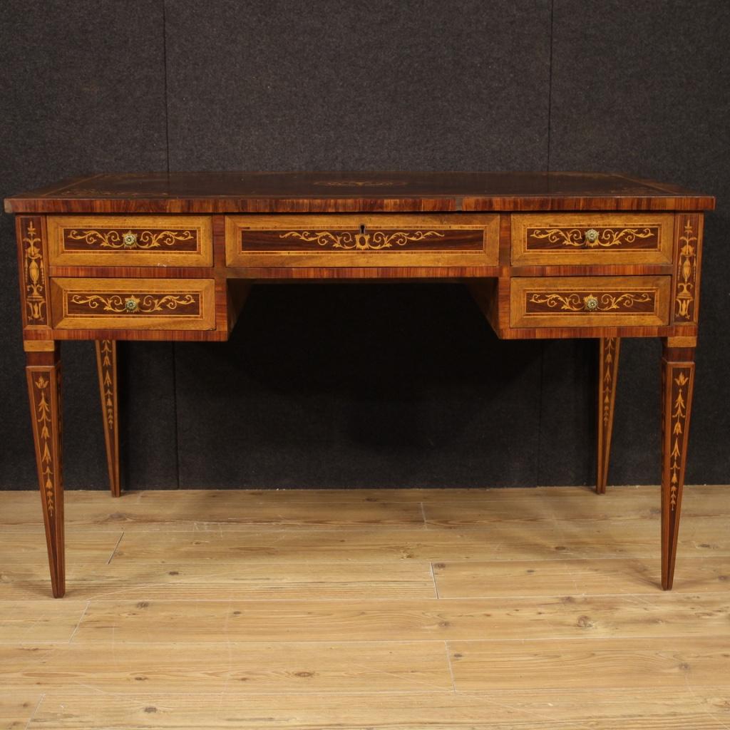 Italian writing desk from 20th century. Furniture richly inlaid in Louis XVI style in walnut, rosewood, maple, palisander and fruitwood. Desk finished for the center (see photo) of great quality and elegance. Furniture equipped with five front